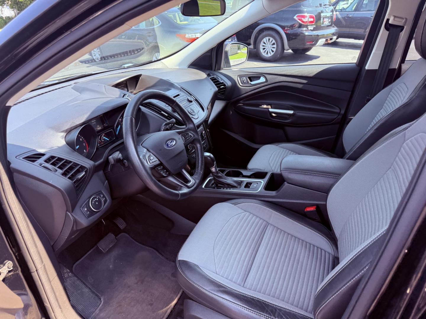 2018 Black /Black Ford Escape SE 4WD (1FMCU9GD6JU) with an 1.5L I4 DOHC 16V Turbo engine, 6A transmission, located at 547 E. Main St., Orwell, OH, 44076, (440) 437-5893, 41.535435, -80.847855 - This 2018 Ford Escape SE 4WD features a 1.5L turbocharged EcoBoost I4 engine paired with a 6-speed automatic transmission, delivering a good balance of power and efficiency (up to 28 MPG highway). It offers comfort and convenience with a power driver’s seat, heated front seats, dual-zone automatic - Photo#17