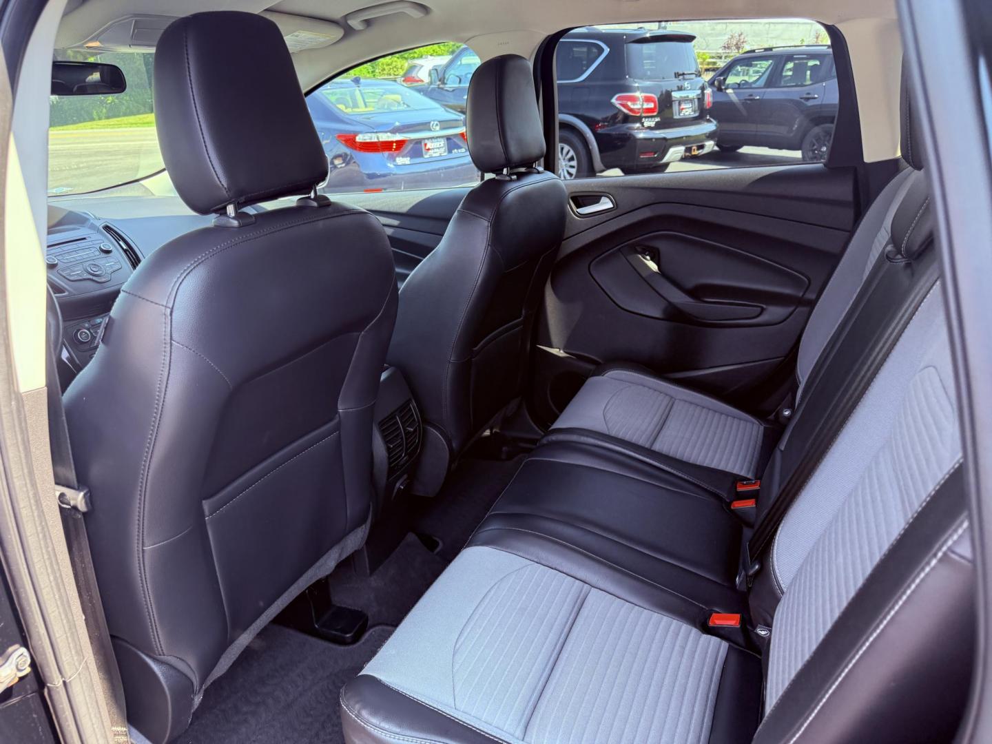 2018 Black /Black Ford Escape SE 4WD (1FMCU9GD6JU) with an 1.5L I4 DOHC 16V Turbo engine, 6A transmission, located at 547 E. Main St., Orwell, OH, 44076, (440) 437-5893, 41.535435, -80.847855 - This 2018 Ford Escape SE 4WD features a 1.5L turbocharged EcoBoost I4 engine paired with a 6-speed automatic transmission, delivering a good balance of power and efficiency (up to 28 MPG highway). It offers comfort and convenience with a power driver’s seat, heated front seats, dual-zone automatic - Photo#31