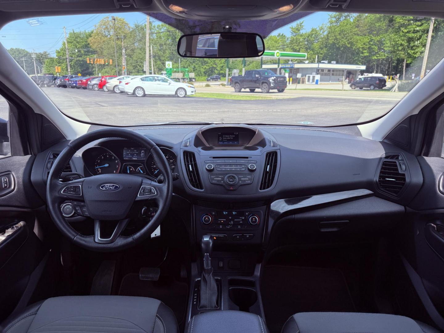 2018 Black /Black Ford Escape SE 4WD (1FMCU9GD6JU) with an 1.5L I4 DOHC 16V Turbo engine, 6A transmission, located at 547 E. Main St., Orwell, OH, 44076, (440) 437-5893, 41.535435, -80.847855 - This 2018 Ford Escape SE 4WD features a 1.5L turbocharged EcoBoost I4 engine paired with a 6-speed automatic transmission, delivering a good balance of power and efficiency (up to 28 MPG highway). It offers comfort and convenience with a power driver’s seat, heated front seats, dual-zone automatic - Photo#34