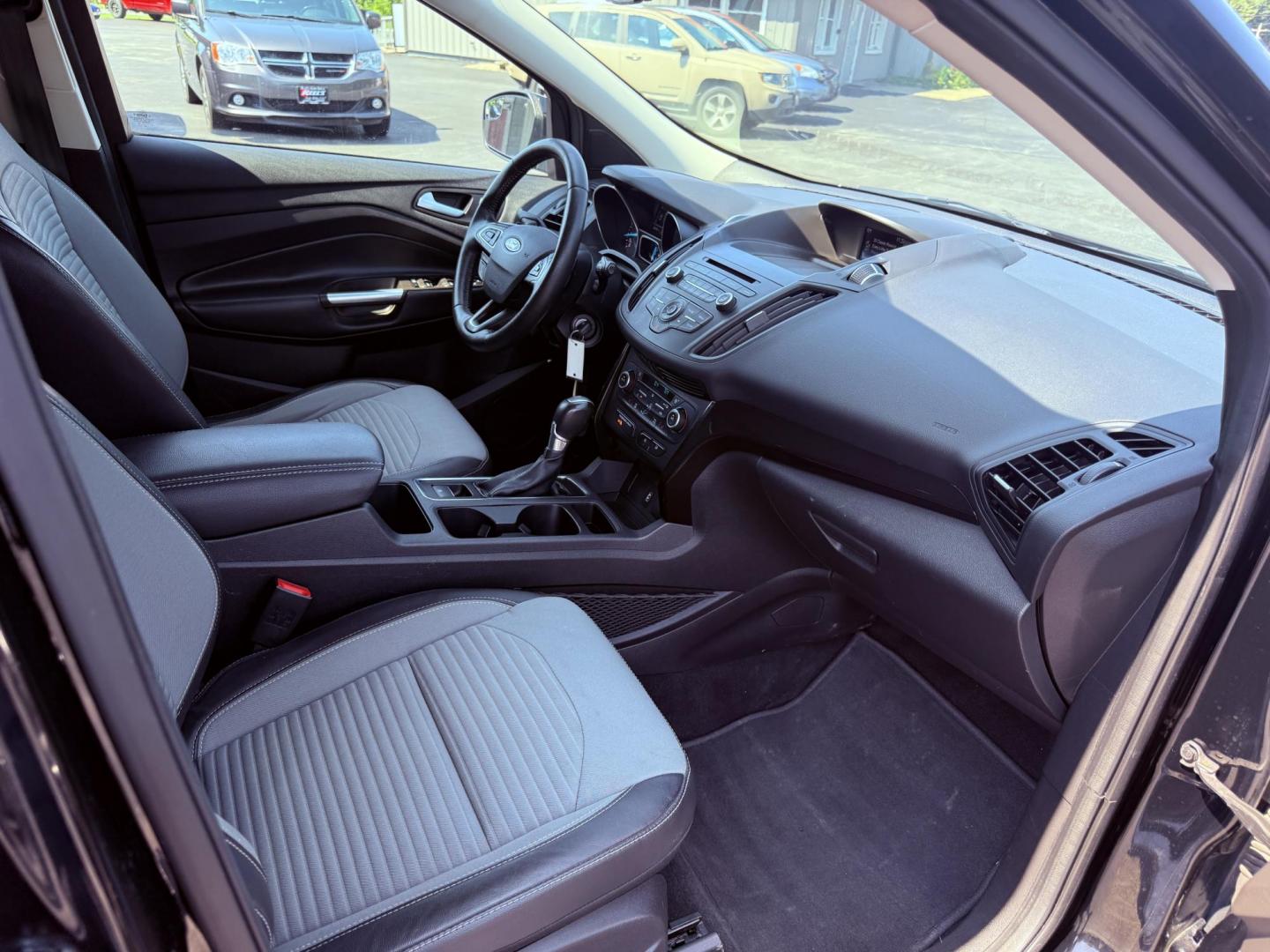 2018 Black /Black Ford Escape SE 4WD (1FMCU9GD6JU) with an 1.5L I4 DOHC 16V Turbo engine, 6A transmission, located at 547 E. Main St., Orwell, OH, 44076, (440) 437-5893, 41.535435, -80.847855 - This 2018 Ford Escape SE 4WD features a 1.5L turbocharged EcoBoost I4 engine paired with a 6-speed automatic transmission, delivering a good balance of power and efficiency (up to 28 MPG highway). It offers comfort and convenience with a power driver’s seat, heated front seats, dual-zone automatic - Photo#39