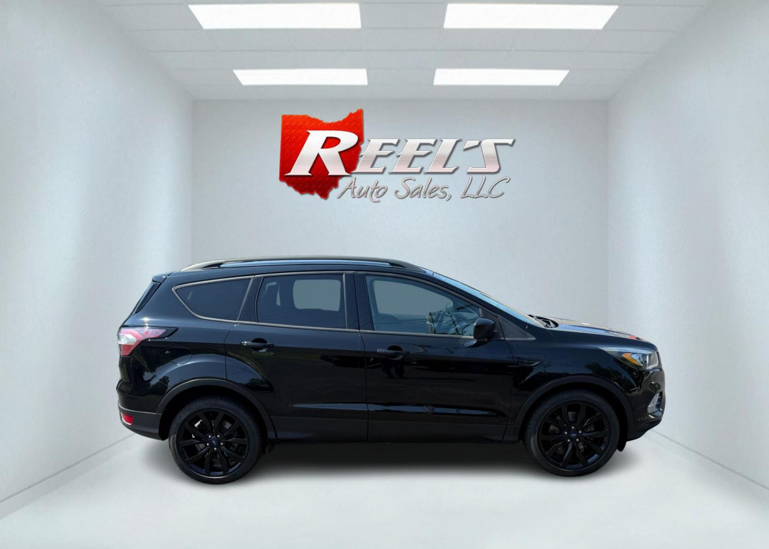 2018 Black /Black Ford Escape SE 4WD (1FMCU9GD6JU) with an 1.5L I4 DOHC 16V Turbo engine, Automatic transmission, located at 547 E. Main St., Orwell, OH, 44076, (440) 437-5893, 41.535435, -80.847855 - 2018 Ford Escape SE 4WD – Sporty Style, Turbocharged Performance, All-Season Confidence Upgrade your drive with this 2018 Ford Escape SE 4WD—an SUV that combines sporty design, smart technology, and practical versatility. Under the hood, you’ll find a turbocharged 1.5L EcoBoost engine paire - Photo#6