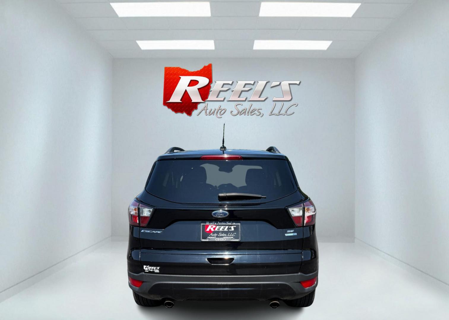 2018 Black /Black Ford Escape SE 4WD (1FMCU9GD6JU) with an 1.5L I4 DOHC 16V Turbo engine, Automatic transmission, located at 547 E. Main St., Orwell, OH, 44076, (440) 437-5893, 41.535435, -80.847855 - 2018 Ford Escape SE 4WD – Sporty Style, Turbocharged Performance, All-Season Confidence Upgrade your drive with this 2018 Ford Escape SE 4WD—an SUV that combines sporty design, smart technology, and practical versatility. Under the hood, you’ll find a turbocharged 1.5L EcoBoost engine paire - Photo#8