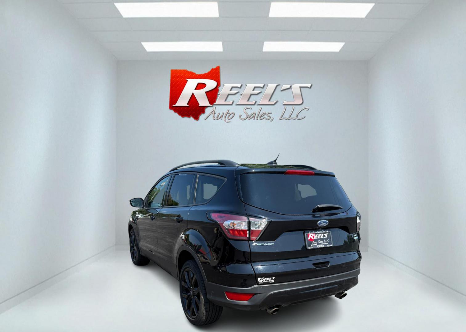 2018 Black /Black Ford Escape SE 4WD (1FMCU9GD6JU) with an 1.5L I4 DOHC 16V Turbo engine, Automatic transmission, located at 547 E. Main St., Orwell, OH, 44076, (440) 437-5893, 41.535435, -80.847855 - 2018 Ford Escape SE 4WD – Sporty Style, Turbocharged Performance, All-Season Confidence Upgrade your drive with this 2018 Ford Escape SE 4WD—an SUV that combines sporty design, smart technology, and practical versatility. Under the hood, you’ll find a turbocharged 1.5L EcoBoost engine paire - Photo#9