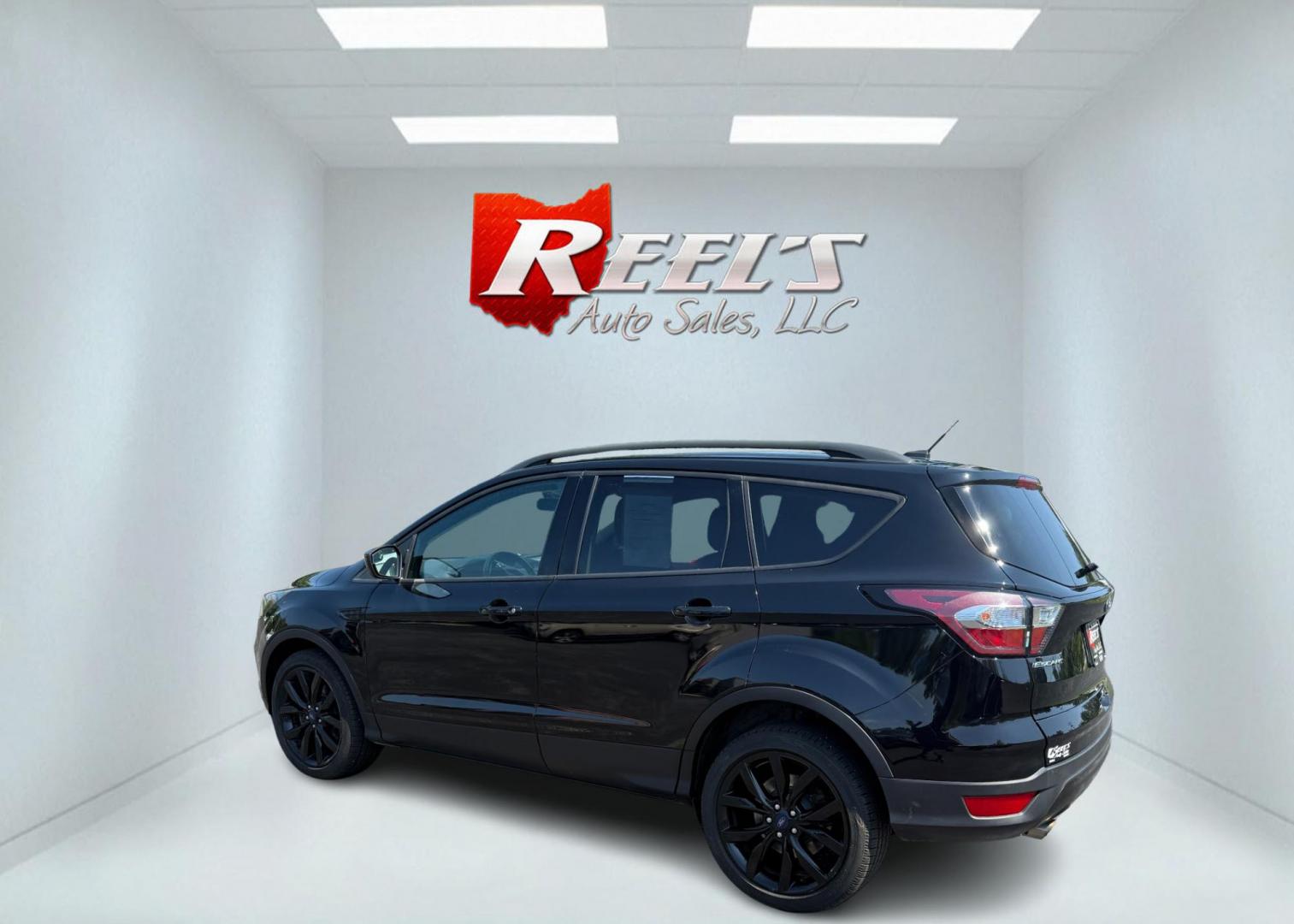 2018 Black /Black Ford Escape SE 4WD (1FMCU9GD6JU) with an 1.5L I4 DOHC 16V Turbo engine, Automatic transmission, located at 547 E. Main St., Orwell, OH, 44076, (440) 437-5893, 41.535435, -80.847855 - 2018 Ford Escape SE 4WD – Sporty Style, Turbocharged Performance, All-Season Confidence Upgrade your drive with this 2018 Ford Escape SE 4WD—an SUV that combines sporty design, smart technology, and practical versatility. Under the hood, you’ll find a turbocharged 1.5L EcoBoost engine paire - Photo#11