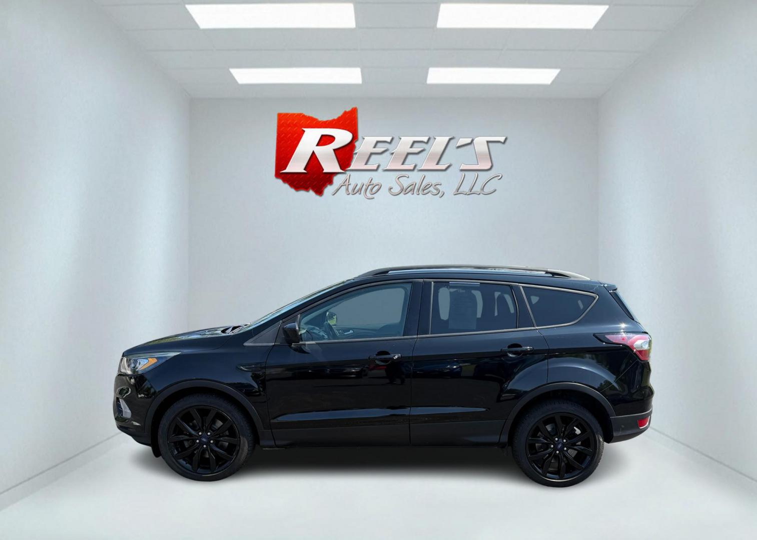 2018 Black /Black Ford Escape SE 4WD (1FMCU9GD6JU) with an 1.5L I4 DOHC 16V Turbo engine, Automatic transmission, located at 547 E. Main St., Orwell, OH, 44076, (440) 437-5893, 41.535435, -80.847855 - 2018 Ford Escape SE 4WD – Sporty Style, Turbocharged Performance, All-Season Confidence Upgrade your drive with this 2018 Ford Escape SE 4WD—an SUV that combines sporty design, smart technology, and practical versatility. Under the hood, you’ll find a turbocharged 1.5L EcoBoost engine paire - Photo#13