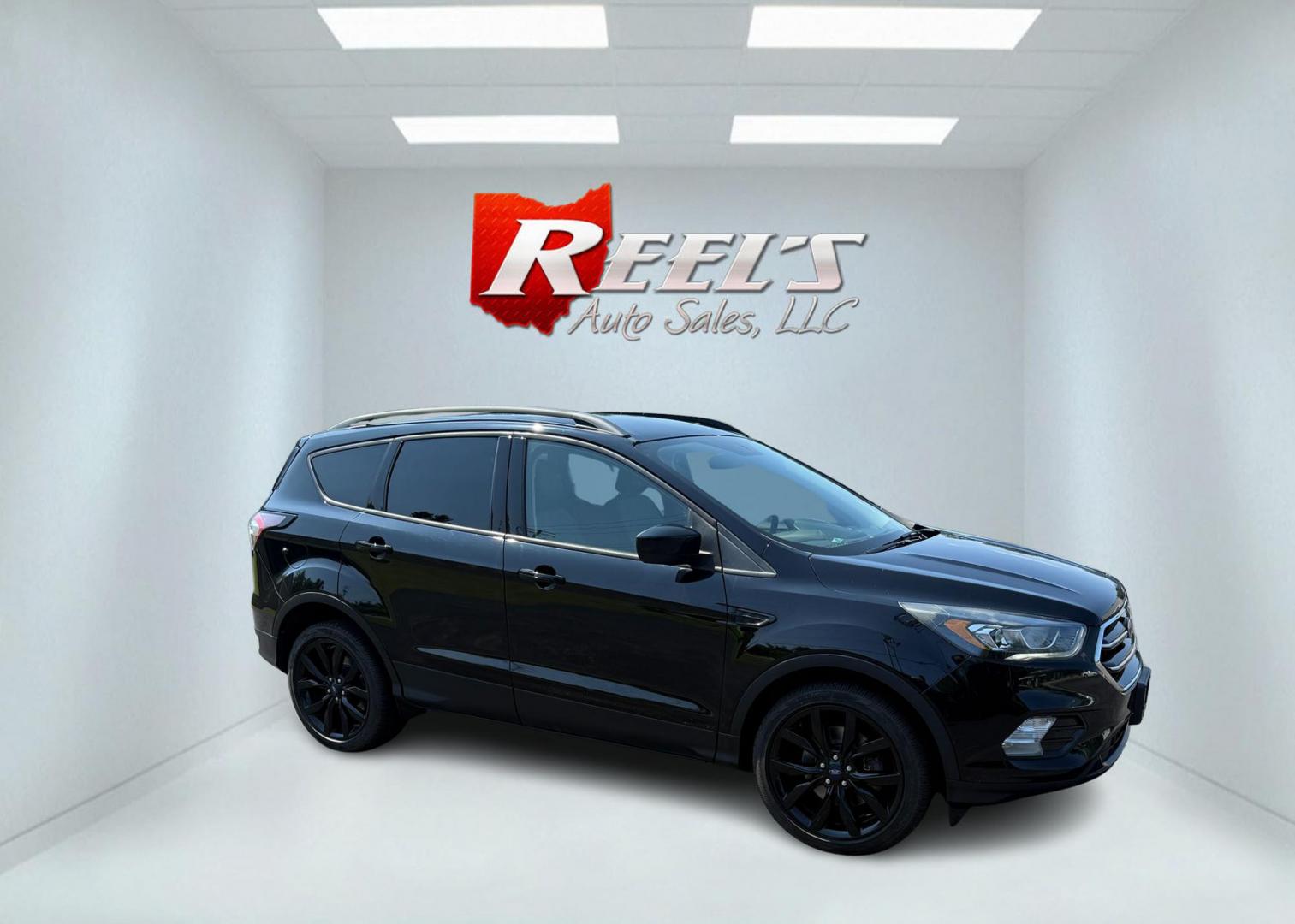 2018 Black /Black Ford Escape SE 4WD (1FMCU9GD6JU) with an 1.5L I4 DOHC 16V Turbo engine, Automatic transmission, located at 547 E. Main St., Orwell, OH, 44076, (440) 437-5893, 41.535435, -80.847855 - 2018 Ford Escape SE 4WD – Sporty Style, Turbocharged Performance, All-Season Confidence Upgrade your drive with this 2018 Ford Escape SE 4WD—an SUV that combines sporty design, smart technology, and practical versatility. Under the hood, you’ll find a turbocharged 1.5L EcoBoost engine paire - Photo#4
