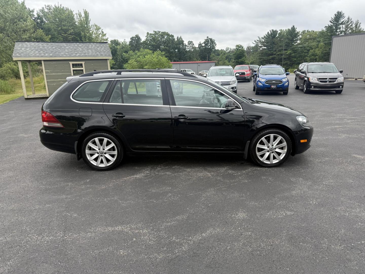 2014 Black /Black Volkswagen Jetta SportWagen 2.0L TDI (3VWPL7AJ9EM) with an 2.0L I4 SOHC 16V TURBO DIESEL engine, 6 Speed Auto transmission, located at 11115 Chardon Rd. , Chardon, OH, 44024, (440) 214-9705, 41.580246, -81.241943 - This 2014 Volkswagen Jetta SportWagen TDI is a versatile diesel-powered wagon featuring a 2.0L turbocharged I4 engine and 6-speed automatic transmission, delivering strong torque and impressive fuel economy at up to 37 MPG highway. Well-equipped for comfort and convenience, it includes leather inte - Photo#5