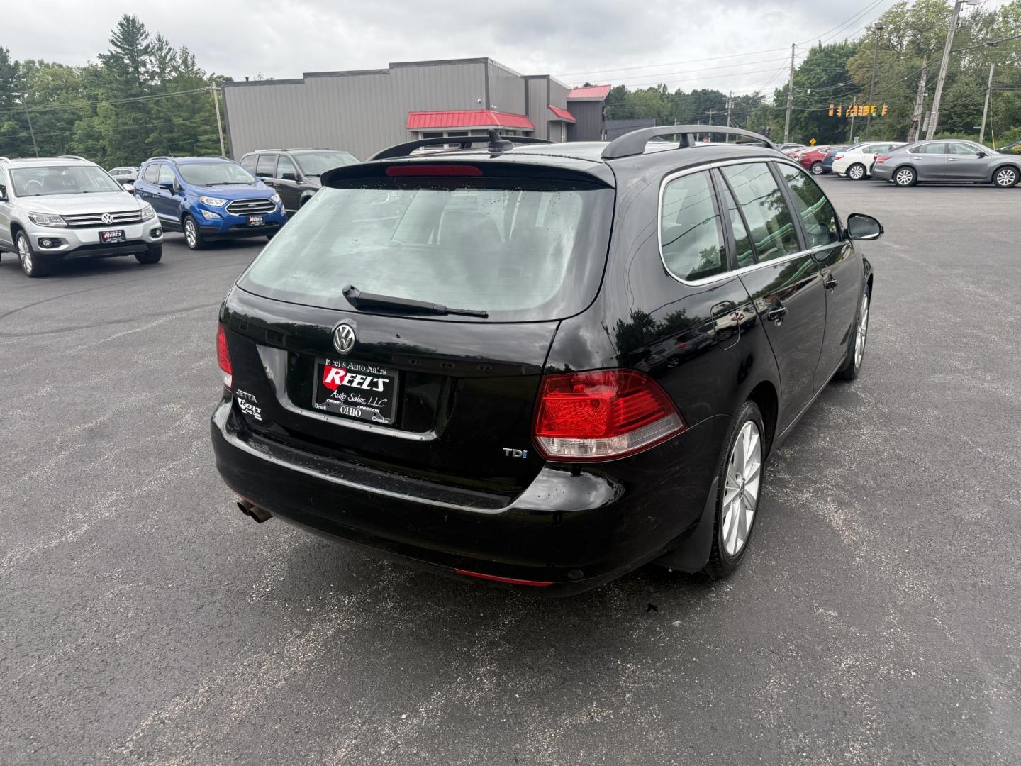 2014 Black /Black Volkswagen Jetta SportWagen 2.0L TDI (3VWPL7AJ9EM) with an 2.0L I4 SOHC 16V TURBO DIESEL engine, 6 Speed Auto transmission, located at 11115 Chardon Rd. , Chardon, OH, 44024, (440) 214-9705, 41.580246, -81.241943 - This 2014 Volkswagen Jetta SportWagen TDI is a versatile diesel-powered wagon featuring a 2.0L turbocharged I4 engine and 6-speed automatic transmission, delivering strong torque and impressive fuel economy at up to 37 MPG highway. Well-equipped for comfort and convenience, it includes leather inte - Photo#7