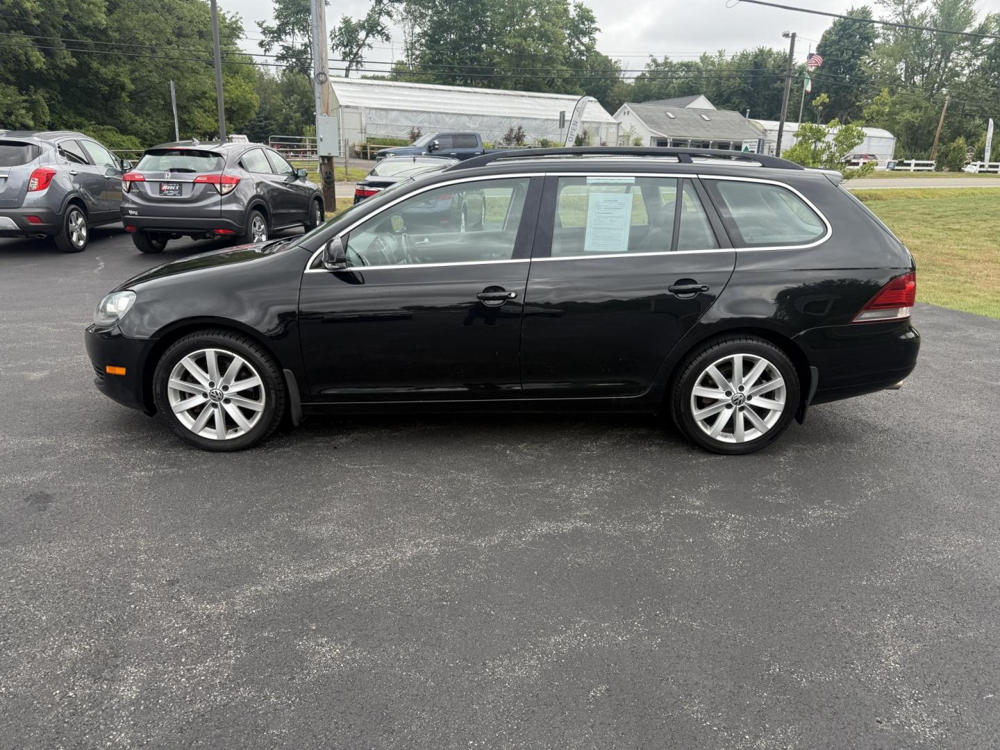 2014 Black /Black Volkswagen Jetta SportWagen 2.0L TDI (3VWPL7AJ9EM) with an 2.0L I4 SOHC 16V TURBO DIESEL engine, 6 Speed Auto transmission, located at 11115 Chardon Rd. , Chardon, OH, 44024, (440) 214-9705, 41.580246, -81.241943 - This 2014 Volkswagen Jetta SportWagen TDI is a versatile diesel-powered wagon featuring a 2.0L turbocharged I4 engine and 6-speed automatic transmission, delivering strong torque and impressive fuel economy at up to 37 MPG highway. Well-equipped for comfort and convenience, it includes leather inte - Photo#12