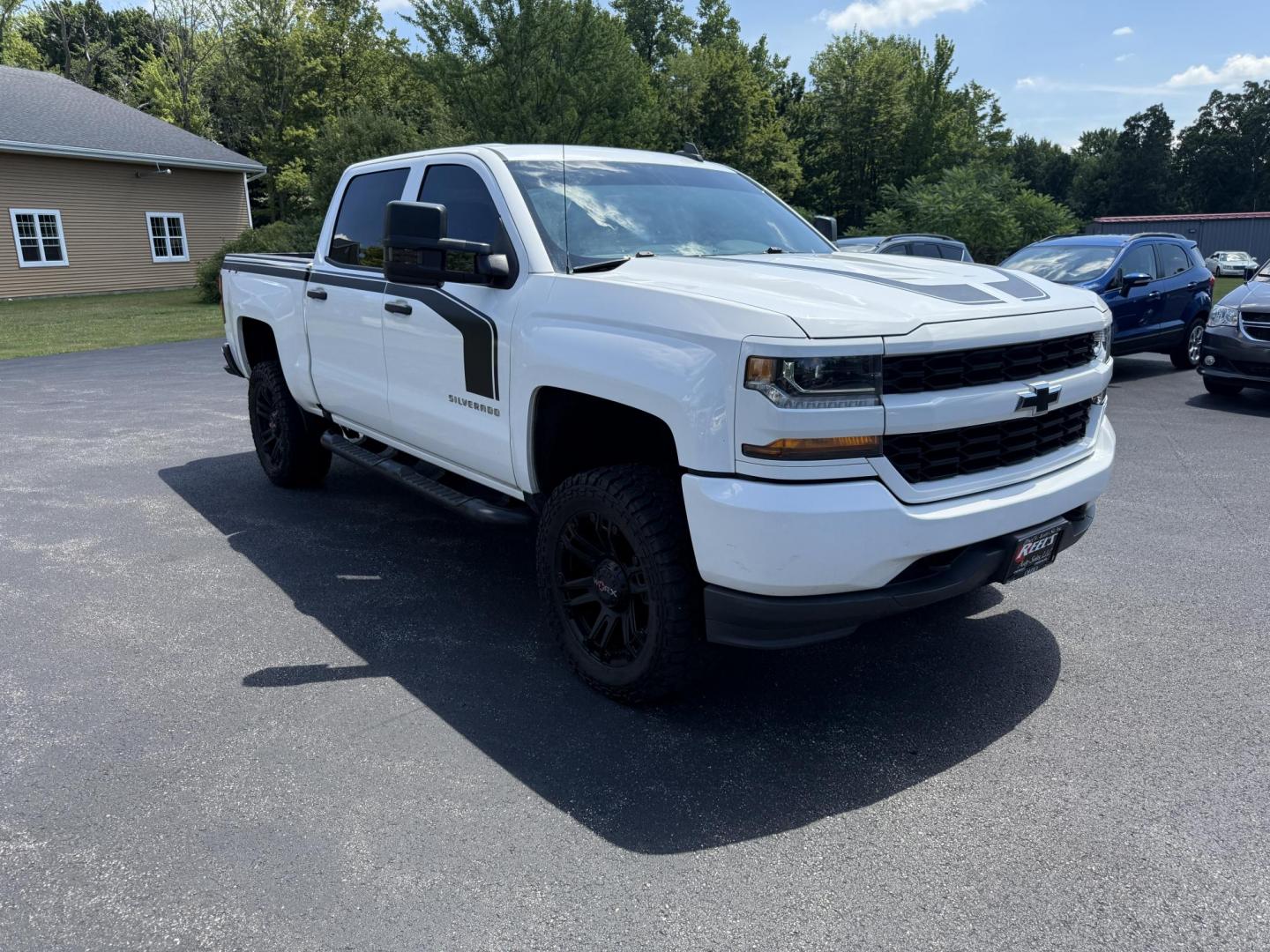 2018 White /Gray Chevrolet Silverado 1500 Custom Crew Cab 4WD (3GCUKPEC7JG) with an 5.3L V8 OHV 16V engine, 6A transmission, located at 11115 Chardon Rd. , Chardon, OH, 44024, (440) 214-9705, 41.580246, -81.241943 - This One Owner 2018 Chevrolet Silverado 1500 Custom Crew Cab with the 5.3L EcoTec3 V8 engine and 6-speed automatic transmission offers solid performance, featuring 3.42 rear axle gearing and the G80 automatic locking rear differential for enhanced traction. With a towing capacity of 9,100 pounds, it - Photo#2