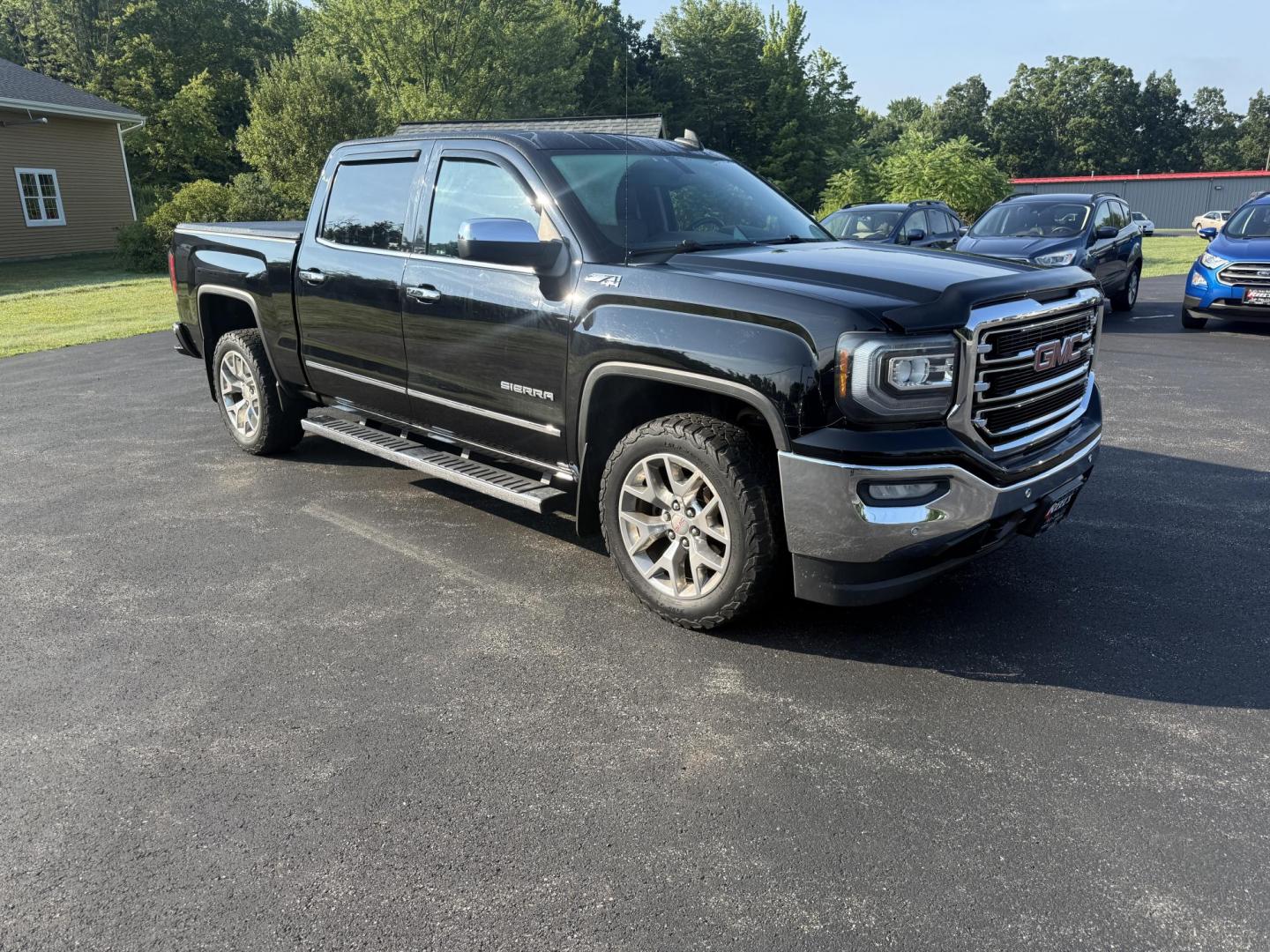 2016 Black /Black GMC Sierra 1500 SLT Crew Cab Long Box 4WD (3GTU2NEC2GG) with an 5.3L V8 OHV 16V engine, 6A transmission, located at 11115 Chardon Rd. , Chardon, OH, 44024, (440) 214-9705, 41.580246, -81.241943 - This One Owner 2016 GMC Sierra 1500 SLT Crew Cab 4WD is equipped with a 5.3L EcoTec3 V8 engine and a 6-speed automatic transmission, delivering a strong 9,100-pound towing capacity thanks to its 3.42 gearing. This model features a refined leather interior with heated front seats, an 8.0" touchscreen - Photo#2