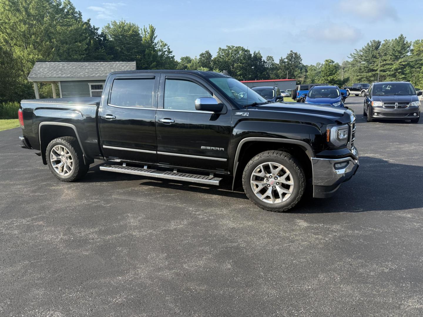 2016 Black /Black GMC Sierra 1500 SLT Crew Cab Long Box 4WD (3GTU2NEC2GG) with an 5.3L V8 OHV 16V engine, 6A transmission, located at 11115 Chardon Rd. , Chardon, OH, 44024, (440) 214-9705, 41.580246, -81.241943 - This One Owner 2016 GMC Sierra 1500 SLT Crew Cab 4WD is equipped with a 5.3L EcoTec3 V8 engine and a 6-speed automatic transmission, delivering a strong 9,100-pound towing capacity thanks to its 3.42 gearing. This model features a refined leather interior with heated front seats, an 8.0" touchscreen - Photo#3