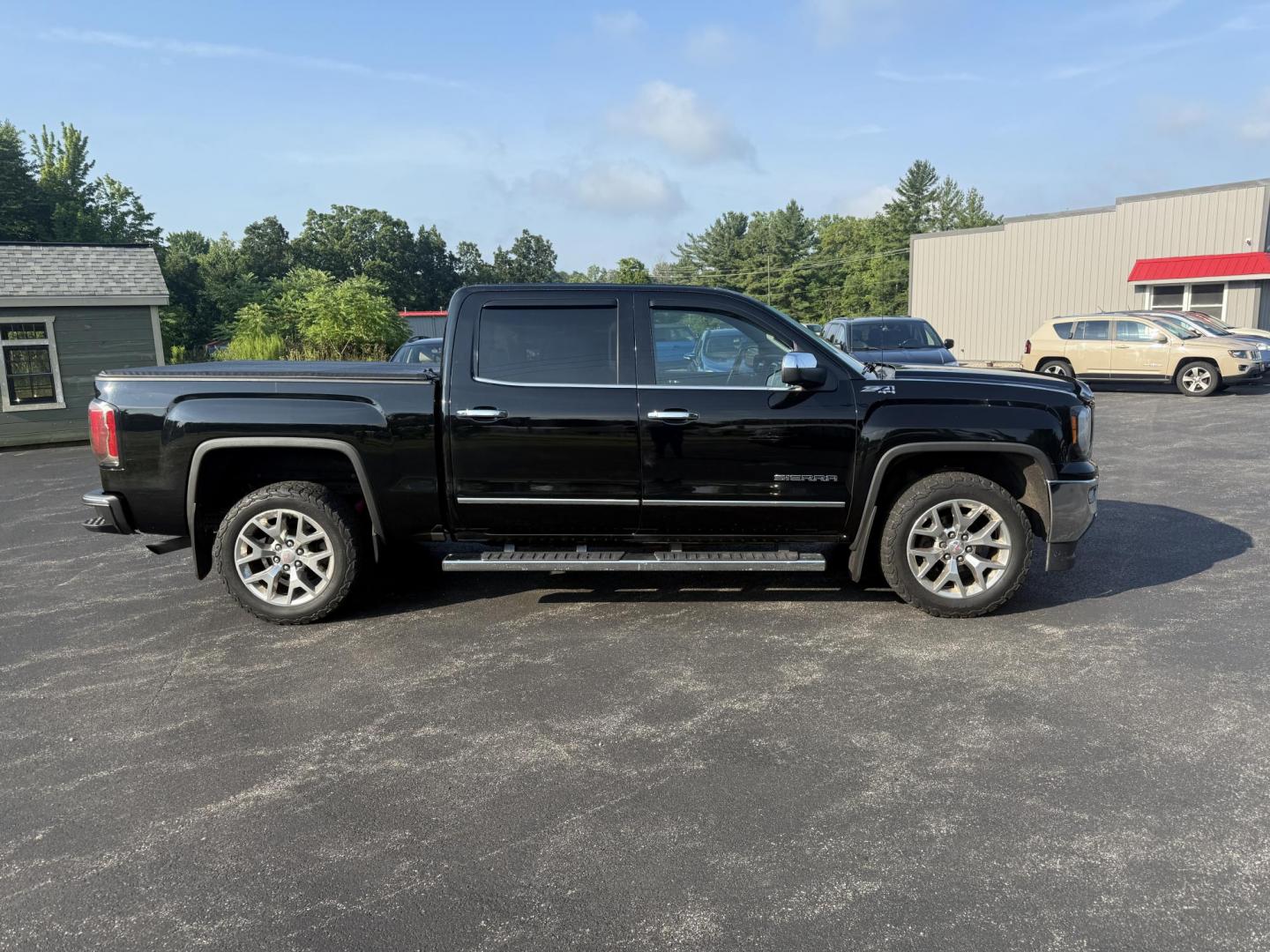2016 Black /Black GMC Sierra 1500 SLT Crew Cab Long Box 4WD (3GTU2NEC2GG) with an 5.3L V8 OHV 16V engine, 6A transmission, located at 11115 Chardon Rd. , Chardon, OH, 44024, (440) 214-9705, 41.580246, -81.241943 - This One Owner 2016 GMC Sierra 1500 SLT Crew Cab 4WD is equipped with a 5.3L EcoTec3 V8 engine and a 6-speed automatic transmission, delivering a strong 9,100-pound towing capacity thanks to its 3.42 gearing. This model features a refined leather interior with heated front seats, an 8.0" touchscreen - Photo#6