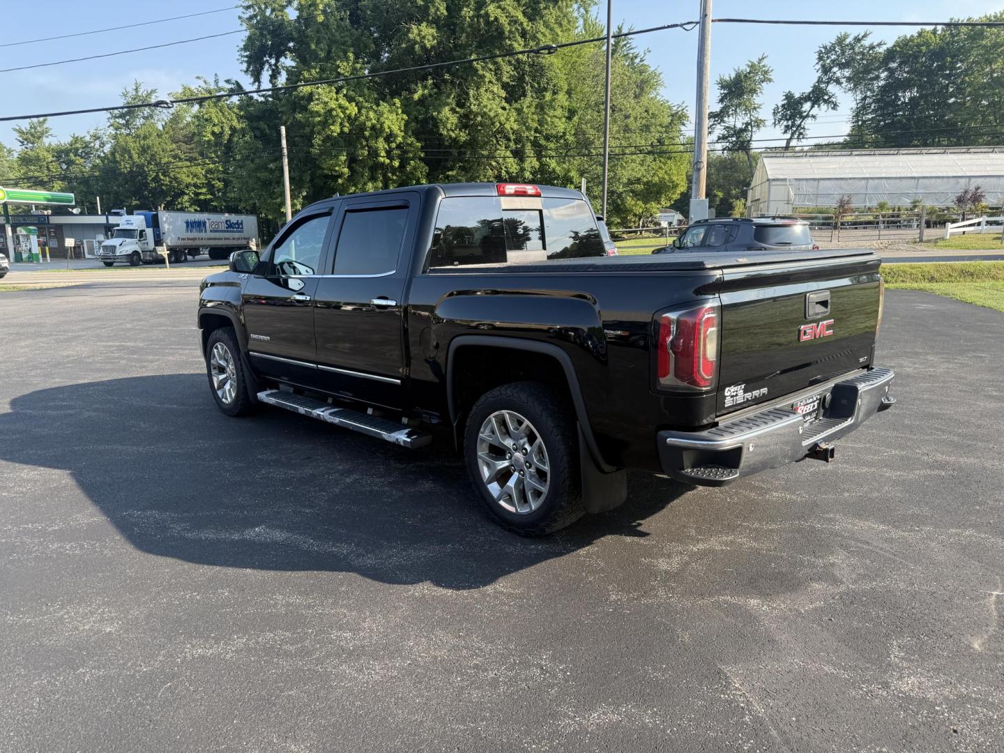2016 Black /Black GMC Sierra 1500 SLT Crew Cab Long Box 4WD (3GTU2NEC2GG) with an 5.3L V8 OHV 16V engine, 6A transmission, located at 11115 Chardon Rd. , Chardon, OH, 44024, (440) 214-9705, 41.580246, -81.241943 - This One Owner 2016 GMC Sierra 1500 SLT Crew Cab 4WD is equipped with a 5.3L EcoTec3 V8 engine and a 6-speed automatic transmission, delivering a strong 9,100-pound towing capacity thanks to its 3.42 gearing. This model features a refined leather interior with heated front seats, an 8.0" touchscreen - Photo#11