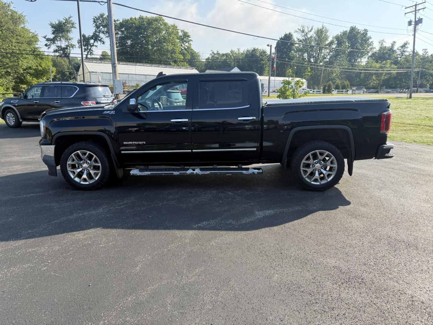 2016 Black /Black GMC Sierra 1500 SLT Crew Cab Long Box 4WD (3GTU2NEC2GG) with an 5.3L V8 OHV 16V engine, 6A transmission, located at 11115 Chardon Rd. , Chardon, OH, 44024, (440) 214-9705, 41.580246, -81.241943 - This One Owner 2016 GMC Sierra 1500 SLT Crew Cab 4WD is equipped with a 5.3L EcoTec3 V8 engine and a 6-speed automatic transmission, delivering a strong 9,100-pound towing capacity thanks to its 3.42 gearing. This model features a refined leather interior with heated front seats, an 8.0" touchscreen - Photo#14
