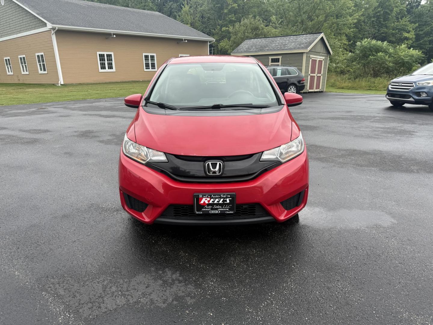 2016 Red /Black Honda Fit LX CVT (JHMGK5H55GX) with an 1.5L I4 SOHC 16V engine, Automatic transmission, located at 11115 Chardon Rd. , Chardon, OH, 44024, (440) 214-9705, 41.580246, -81.241943 - This One Owner 2016 Honda Fit LX is a practical and efficient subcompact hatchback powered by a 1.5L inline-4 engine, delivering impressive fuel economy of up to 40 MPG on the highway. It features a 5.0" center screen, backup camera, daytime running lights, ECO mode for enhanced efficiency, and spor - Photo#1