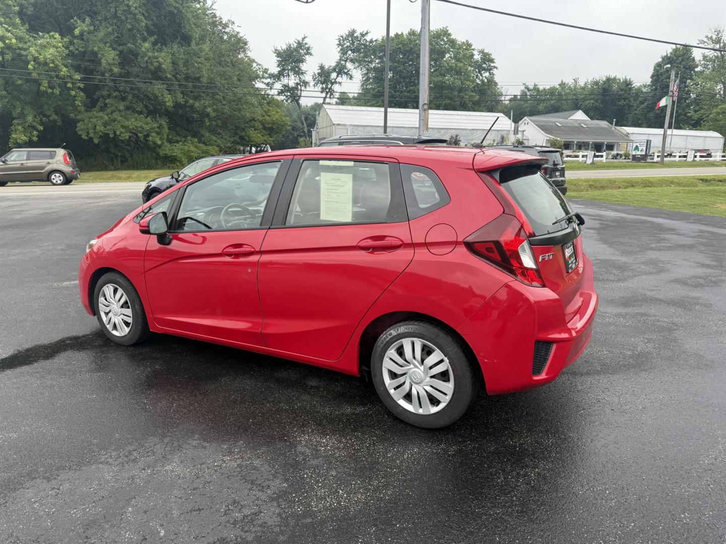 2016 Red /Black Honda Fit LX CVT (JHMGK5H55GX) with an 1.5L I4 SOHC 16V engine, Automatic transmission, located at 11115 Chardon Rd. , Chardon, OH, 44024, (440) 214-9705, 41.580246, -81.241943 - This One Owner 2016 Honda Fit LX is a practical and efficient subcompact hatchback powered by a 1.5L inline-4 engine, delivering impressive fuel economy of up to 40 MPG on the highway. It features a 5.0" center screen, backup camera, daytime running lights, ECO mode for enhanced efficiency, and spor - Photo#10