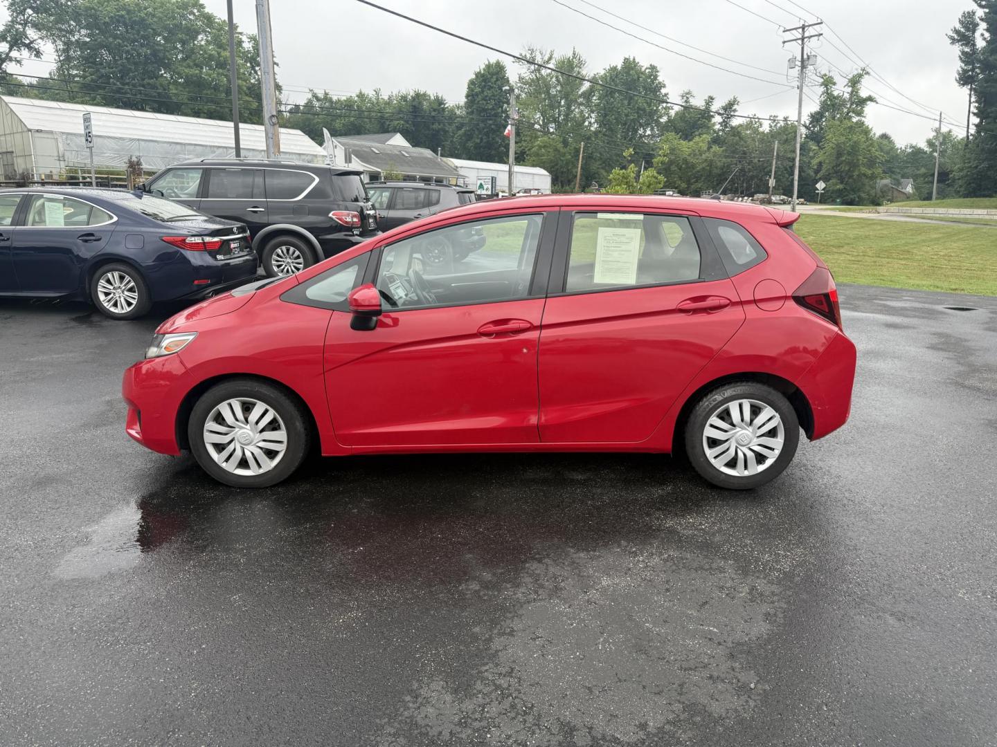 2016 Red /Black Honda Fit LX CVT (JHMGK5H55GX) with an 1.5L I4 SOHC 16V engine, Automatic transmission, located at 11115 Chardon Rd. , Chardon, OH, 44024, (440) 214-9705, 41.580246, -81.241943 - This One Owner 2016 Honda Fit LX is a practical and efficient subcompact hatchback powered by a 1.5L inline-4 engine, delivering impressive fuel economy of up to 40 MPG on the highway. It features a 5.0" center screen, backup camera, daytime running lights, ECO mode for enhanced efficiency, and spor - Photo#12