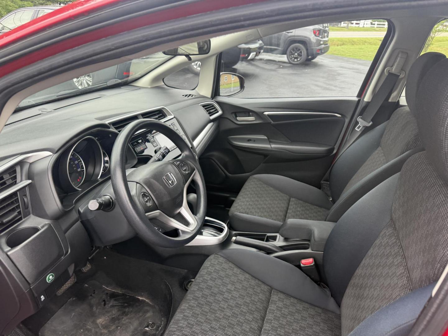2016 Red /Black Honda Fit LX CVT (JHMGK5H55GX) with an 1.5L I4 SOHC 16V engine, Automatic transmission, located at 11115 Chardon Rd. , Chardon, OH, 44024, (440) 214-9705, 41.580246, -81.241943 - This One Owner 2016 Honda Fit LX is a practical and efficient subcompact hatchback powered by a 1.5L inline-4 engine, delivering impressive fuel economy of up to 40 MPG on the highway. It features a 5.0" center screen, backup camera, daytime running lights, ECO mode for enhanced efficiency, and spor - Photo#14