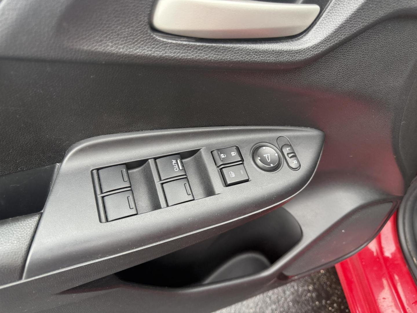 2016 Red /Black Honda Fit LX CVT (JHMGK5H55GX) with an 1.5L I4 SOHC 16V engine, Automatic transmission, located at 11115 Chardon Rd. , Chardon, OH, 44024, (440) 214-9705, 41.580246, -81.241943 - This One Owner 2016 Honda Fit LX is a practical and efficient subcompact hatchback powered by a 1.5L inline-4 engine, delivering impressive fuel economy of up to 40 MPG on the highway. It features a 5.0" center screen, backup camera, daytime running lights, ECO mode for enhanced efficiency, and spor - Photo#16