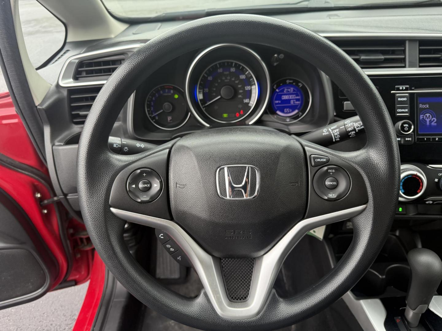 2016 Red /Black Honda Fit LX CVT (JHMGK5H55GX) with an 1.5L I4 SOHC 16V engine, Automatic transmission, located at 11115 Chardon Rd. , Chardon, OH, 44024, (440) 214-9705, 41.580246, -81.241943 - This One Owner 2016 Honda Fit LX is a practical and efficient subcompact hatchback powered by a 1.5L inline-4 engine, delivering impressive fuel economy of up to 40 MPG on the highway. It features a 5.0" center screen, backup camera, daytime running lights, ECO mode for enhanced efficiency, and spor - Photo#20