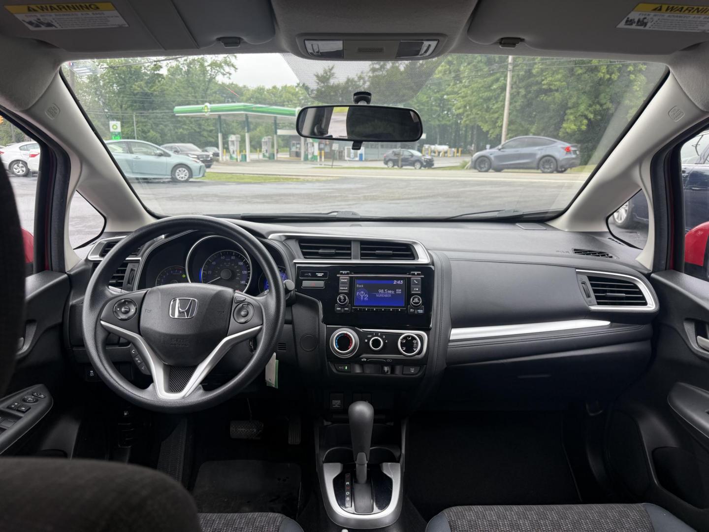 2016 Red /Black Honda Fit LX CVT (JHMGK5H55GX) with an 1.5L I4 SOHC 16V engine, Automatic transmission, located at 11115 Chardon Rd. , Chardon, OH, 44024, (440) 214-9705, 41.580246, -81.241943 - This One Owner 2016 Honda Fit LX is a practical and efficient subcompact hatchback powered by a 1.5L inline-4 engine, delivering impressive fuel economy of up to 40 MPG on the highway. It features a 5.0" center screen, backup camera, daytime running lights, ECO mode for enhanced efficiency, and spor - Photo#27