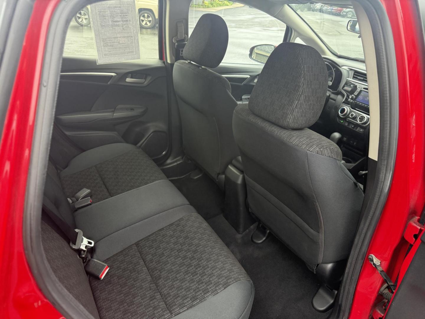 2016 Red /Black Honda Fit LX CVT (JHMGK5H55GX) with an 1.5L I4 SOHC 16V engine, Automatic transmission, located at 11115 Chardon Rd. , Chardon, OH, 44024, (440) 214-9705, 41.580246, -81.241943 - This One Owner 2016 Honda Fit LX is a practical and efficient subcompact hatchback powered by a 1.5L inline-4 engine, delivering impressive fuel economy of up to 40 MPG on the highway. It features a 5.0" center screen, backup camera, daytime running lights, ECO mode for enhanced efficiency, and spor - Photo#30