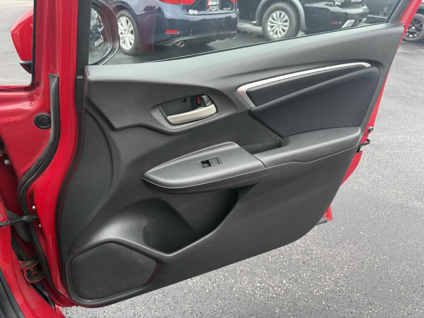 2016 Red /Black Honda Fit LX CVT (JHMGK5H55GX) with an 1.5L I4 SOHC 16V engine, Automatic transmission, located at 11115 Chardon Rd. , Chardon, OH, 44024, (440) 214-9705, 41.580246, -81.241943 - This One Owner 2016 Honda Fit LX is a practical and efficient subcompact hatchback powered by a 1.5L inline-4 engine, delivering impressive fuel economy of up to 40 MPG on the highway. It features a 5.0" center screen, backup camera, daytime running lights, ECO mode for enhanced efficiency, and spor - Photo#36