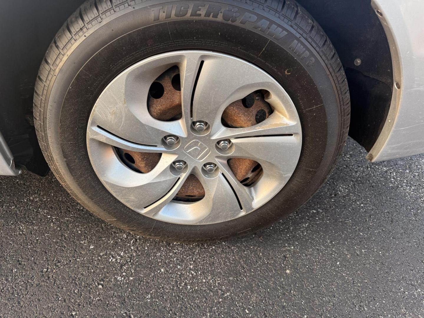 2015 Silver /Gray Honda Civic LX Sedan CVT (19XFB2F51FE) with an 1.8L I4 SOHC 16V engine, Automatic transmission, located at 11115 Chardon Rd. , Chardon, OH, 44024, (440) 214-9705, 41.580246, -81.241943 - This 2015 Honda Civic LX Sedan features a 1.8-liter inline-4 engine with Honda's ECO Assist technology, delivering up to 37 MPG on the highway for efficient commuting. Standard features include daytime running lights, a backup camera for added safety, and a USB audio input for convenient connectivit - Photo#11