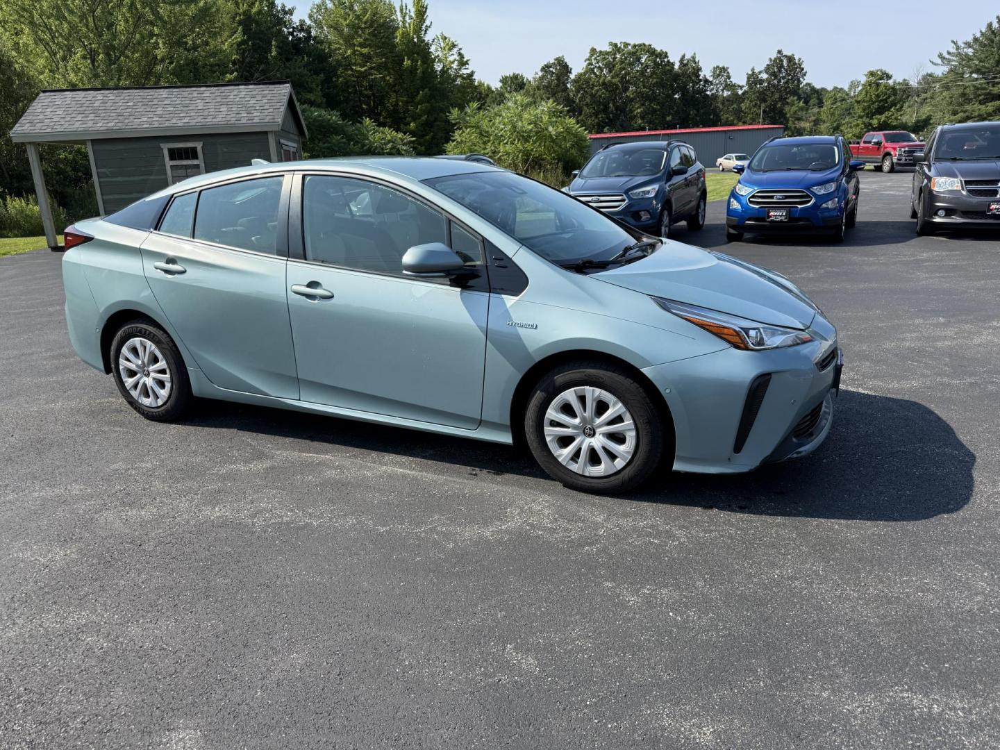 2019 Green /White Toyota Prius LE (JTDKARFU6K3) with an 1.8L I4 DOHC 16V HYBRID engine, Automatic transmission, located at 11115 Chardon Rd. , Chardon, OH, 44024, (440) 214-9705, 41.580246, -81.241943 - This One Owner 2019 Toyota Prius LE offers an impressive 50 MPG combined fuel efficiency and comes well-equipped with features such as full exterior LED lighting, adaptive cruise control, lane keep assist, front and rear parking sensors, forward collision warning, and blind spot monitoring for enhan - Photo#3
