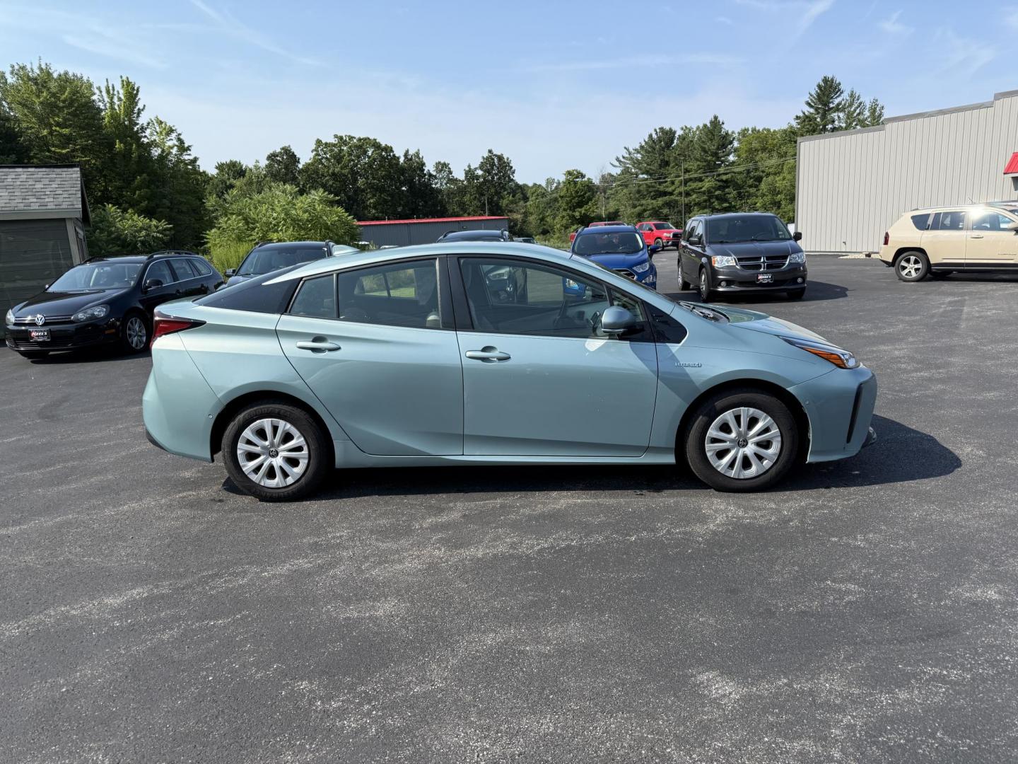 2019 Green /White Toyota Prius LE (JTDKARFU6K3) with an 1.8L I4 DOHC 16V HYBRID engine, Automatic transmission, located at 11115 Chardon Rd. , Chardon, OH, 44024, (440) 214-9705, 41.580246, -81.241943 - This One Owner 2019 Toyota Prius LE offers an impressive 50 MPG combined fuel efficiency and comes well-equipped with features such as full exterior LED lighting, adaptive cruise control, lane keep assist, front and rear parking sensors, forward collision warning, and blind spot monitoring for enhan - Photo#5