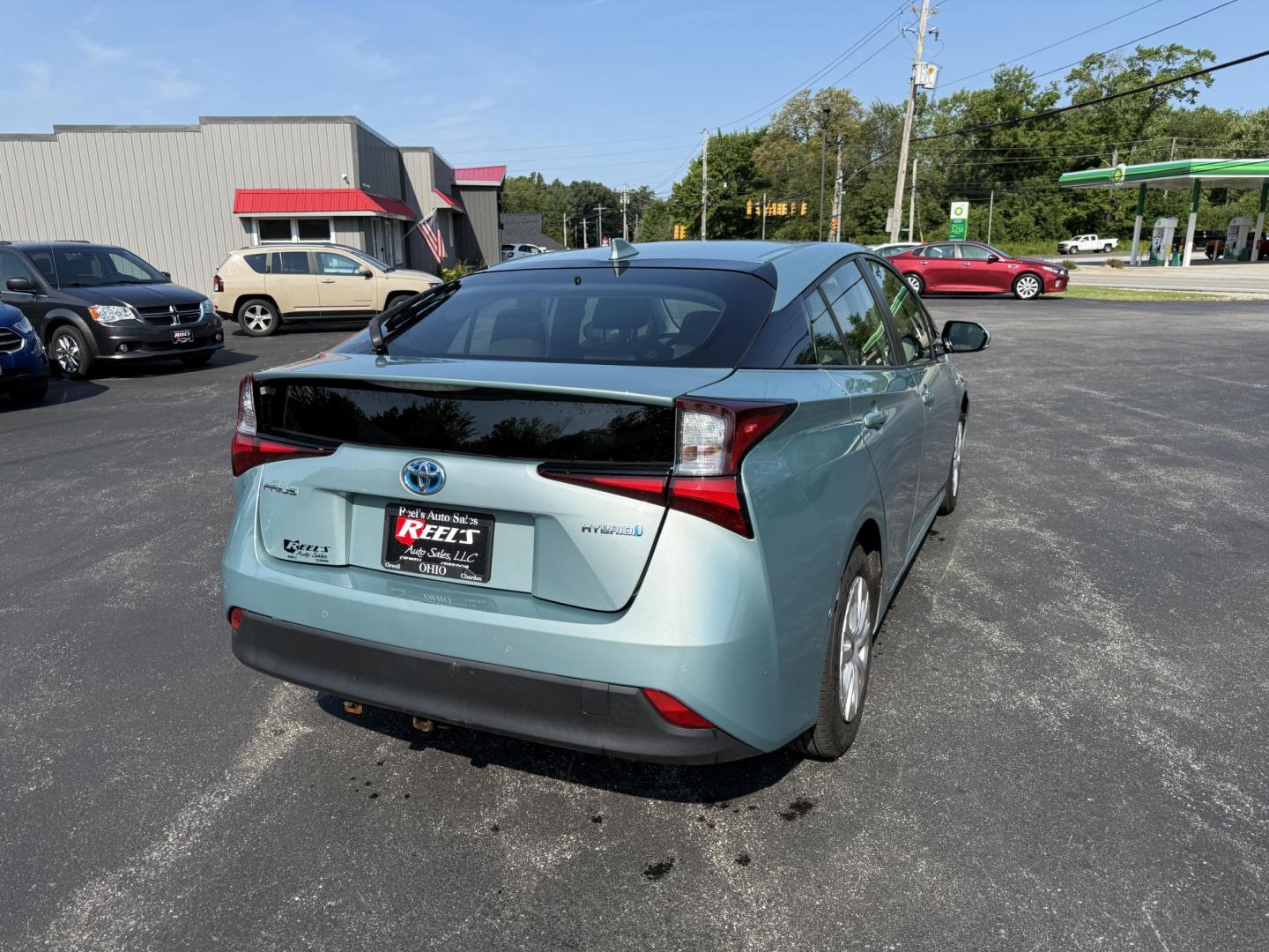 2019 Green /White Toyota Prius LE (JTDKARFU6K3) with an 1.8L I4 DOHC 16V HYBRID engine, Automatic transmission, located at 11115 Chardon Rd. , Chardon, OH, 44024, (440) 214-9705, 41.580246, -81.241943 - This One Owner 2019 Toyota Prius LE offers an impressive 50 MPG combined fuel efficiency and comes well-equipped with features such as full exterior LED lighting, adaptive cruise control, lane keep assist, front and rear parking sensors, forward collision warning, and blind spot monitoring for enhan - Photo#7