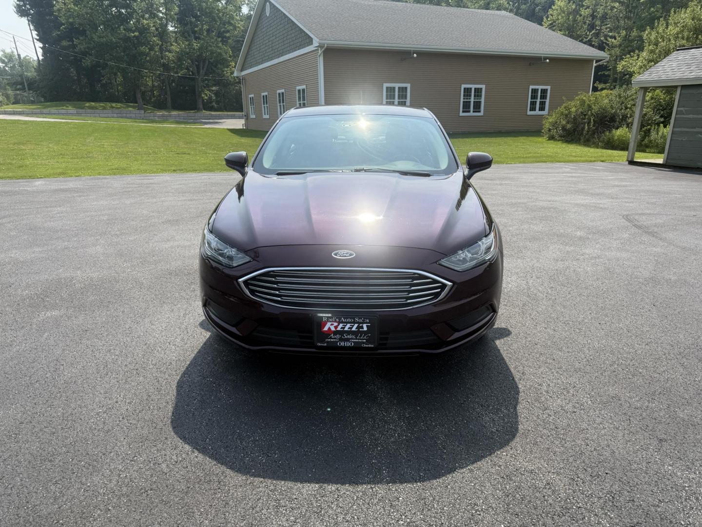 2018 Burgundy /Black Ford Fusion SE (3FA6P0HD7JR) with an 1.5L I4 DOHC 16V Turbo engine, 6A transmission, located at 11115 Chardon Rd. , Chardon, OH, 44024, (440) 214-9705, 41.580246, -81.241943 - This One Owner 2018 Ford Fusion SE FWD is powered by a 1.5L turbocharged EcoBoost I4 engine paired with a 6-speed automatic transmission, delivering up to 34 MPG on the highway. It features an 8.0-inch center touchscreen with Apple CarPlay and Android Auto, dual zone automatic climate control, power - Photo#1