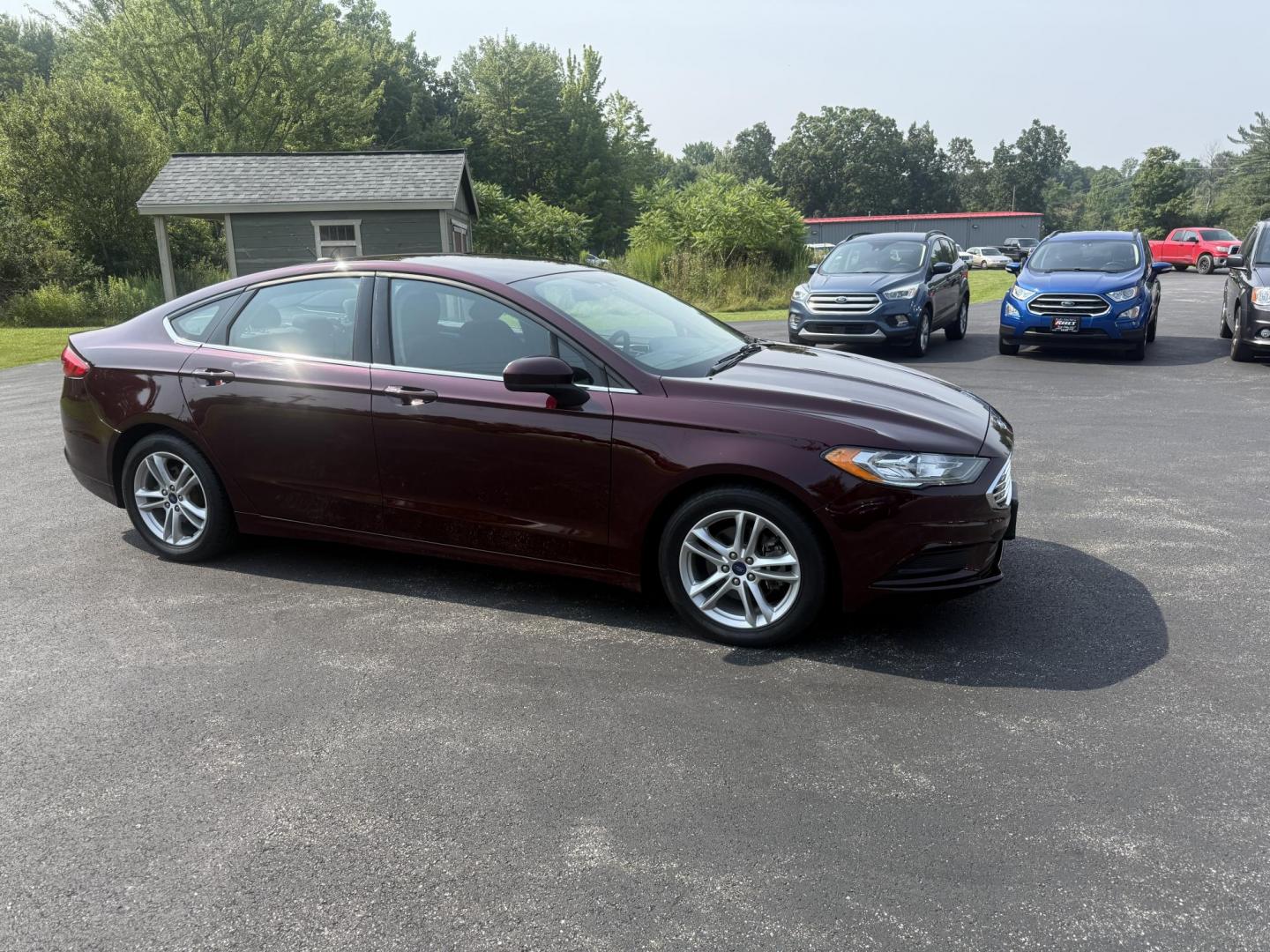 2018 Burgundy /Black Ford Fusion SE (3FA6P0HD7JR) with an 1.5L I4 DOHC 16V Turbo engine, 6A transmission, located at 11115 Chardon Rd. , Chardon, OH, 44024, (440) 214-9705, 41.580246, -81.241943 - This One Owner 2018 Ford Fusion SE FWD is powered by a 1.5L turbocharged EcoBoost I4 engine paired with a 6-speed automatic transmission, delivering up to 34 MPG on the highway. It features an 8.0-inch center touchscreen with Apple CarPlay and Android Auto, dual zone automatic climate control, power - Photo#3