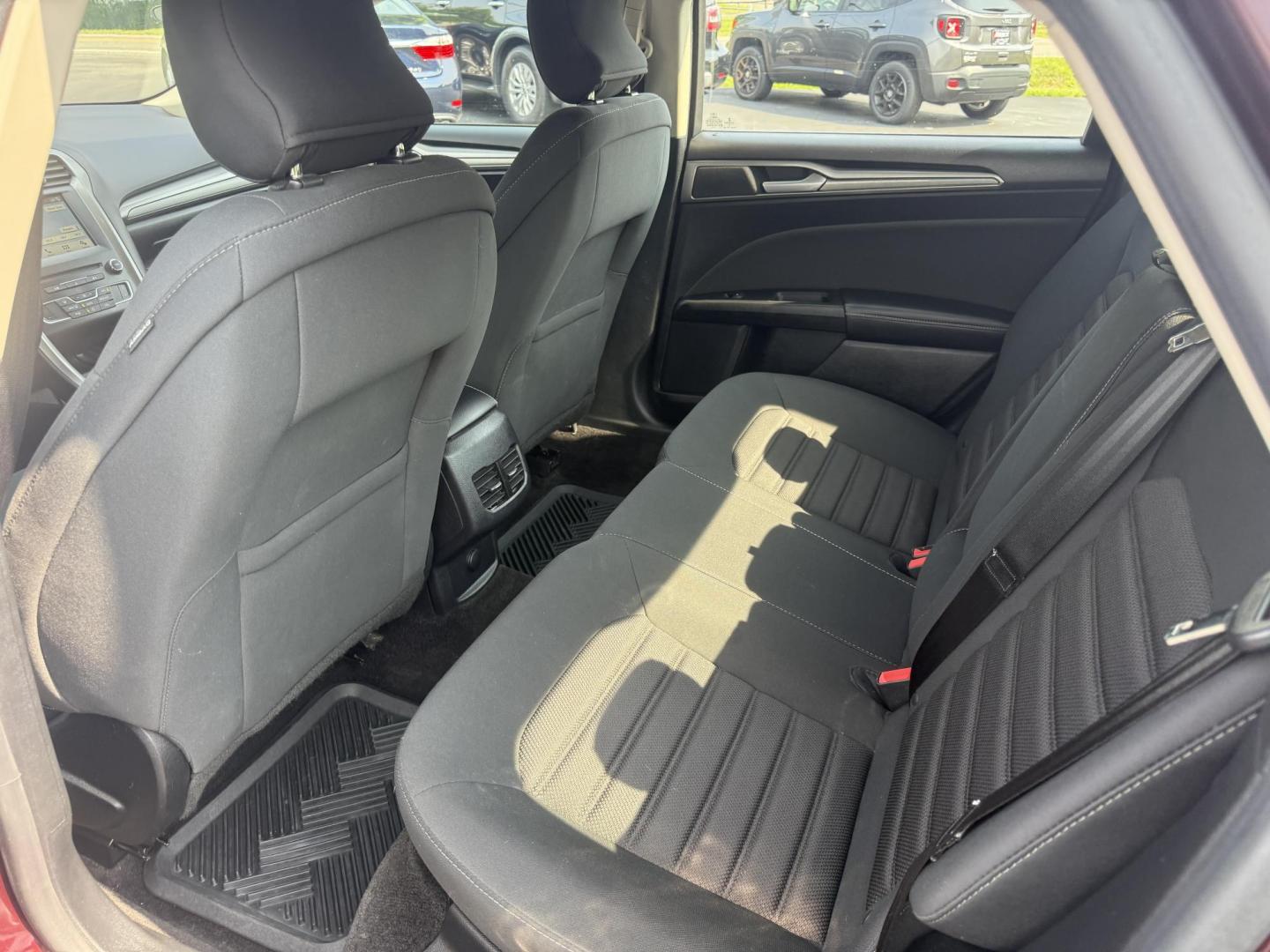 2018 Burgundy /Black Ford Fusion SE (3FA6P0HD7JR) with an 1.5L I4 DOHC 16V Turbo engine, 6A transmission, located at 11115 Chardon Rd. , Chardon, OH, 44024, (440) 214-9705, 41.580246, -81.241943 - This One Owner 2018 Ford Fusion SE FWD is powered by a 1.5L turbocharged EcoBoost I4 engine paired with a 6-speed automatic transmission, delivering up to 34 MPG on the highway. It features an 8.0-inch center touchscreen with Apple CarPlay and Android Auto, dual zone automatic climate control, power - Photo#32