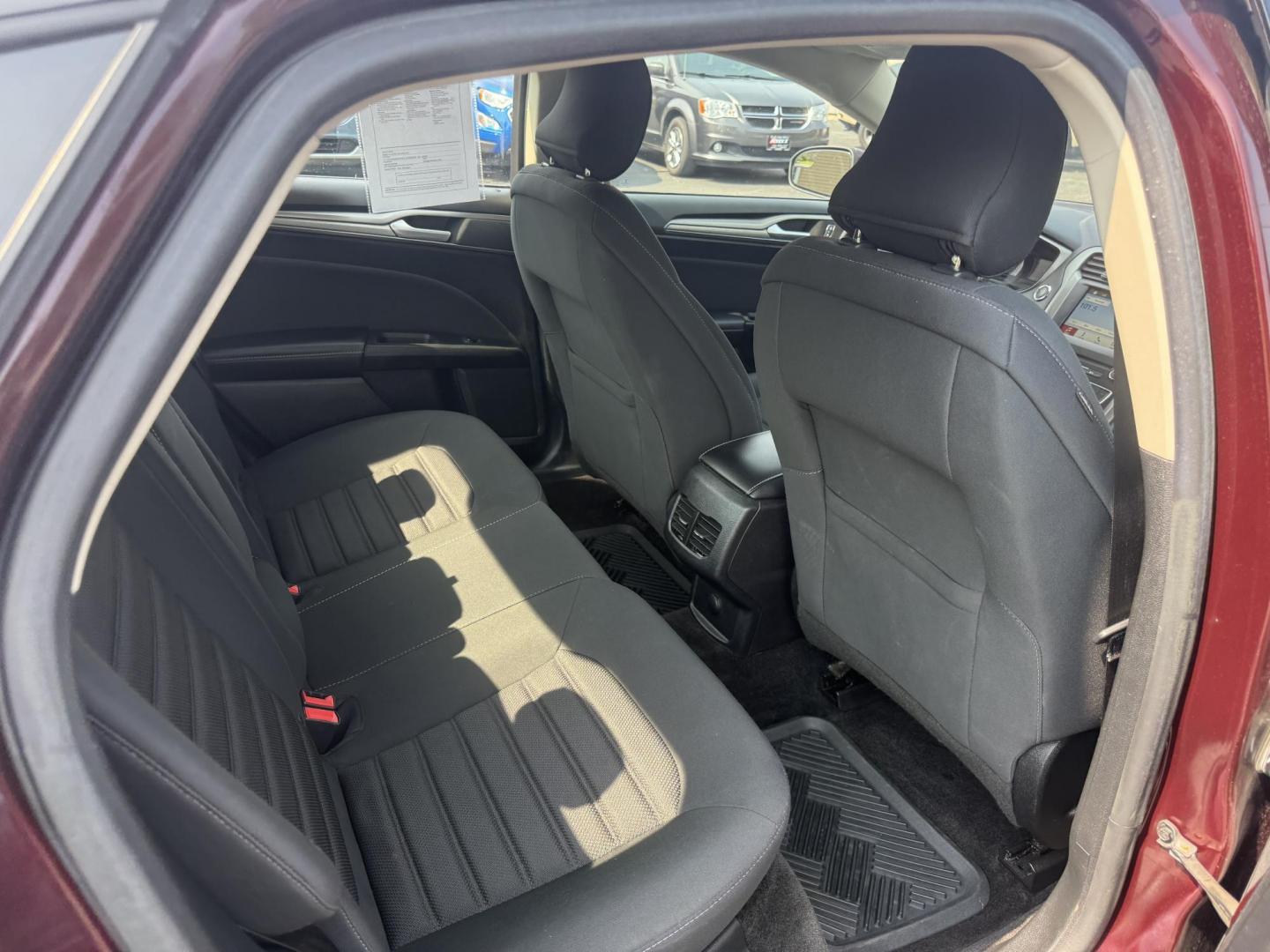 2018 Burgundy /Black Ford Fusion SE (3FA6P0HD7JR) with an 1.5L I4 DOHC 16V Turbo engine, 6A transmission, located at 11115 Chardon Rd. , Chardon, OH, 44024, (440) 214-9705, 41.580246, -81.241943 - This One Owner 2018 Ford Fusion SE FWD is powered by a 1.5L turbocharged EcoBoost I4 engine paired with a 6-speed automatic transmission, delivering up to 34 MPG on the highway. It features an 8.0-inch center touchscreen with Apple CarPlay and Android Auto, dual zone automatic climate control, power - Photo#38