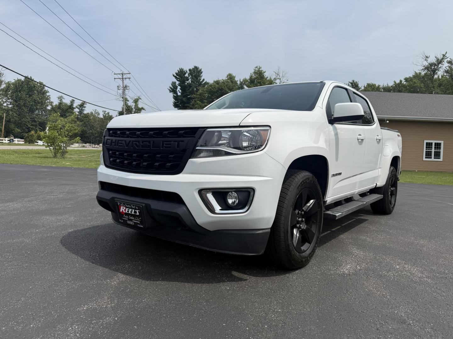 2016 White /Black Chevrolet Colorado LT Crew Cab 4WD Short Box (1GCGTCE36G1) with an 3.6L V6 DOHC 24V GAS engine, 6A transmission, located at 11115 Chardon Rd. , Chardon, OH, 44024, (440) 214-9705, 41.580246, -81.241943 - Photo#0