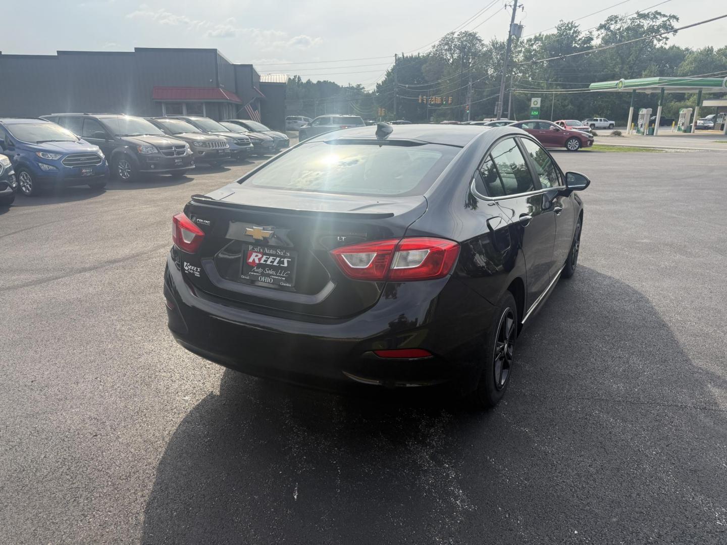 2016 Black /Black Chevrolet Cruze LT Auto (1G1BE5SM1G7) with an 1.4L I4 DOHC 16V TURBO engine, 6A transmission, located at 11115 Chardon Rd. , Chardon, OH, 44024, (440) 214-9705, 41.580246, -81.241943 - This 2016 Chevrolet Cruze LT RS features a 1.4L turbocharged EcoTec I4 engine with a 6-speed automatic transmission, achieving up to 40 MPG on the highway. This well-equipped sedan includes a power driver’s seat, push button start, heated front seats, remote start, the sporty RS package, a 7.0-inc - Photo#7