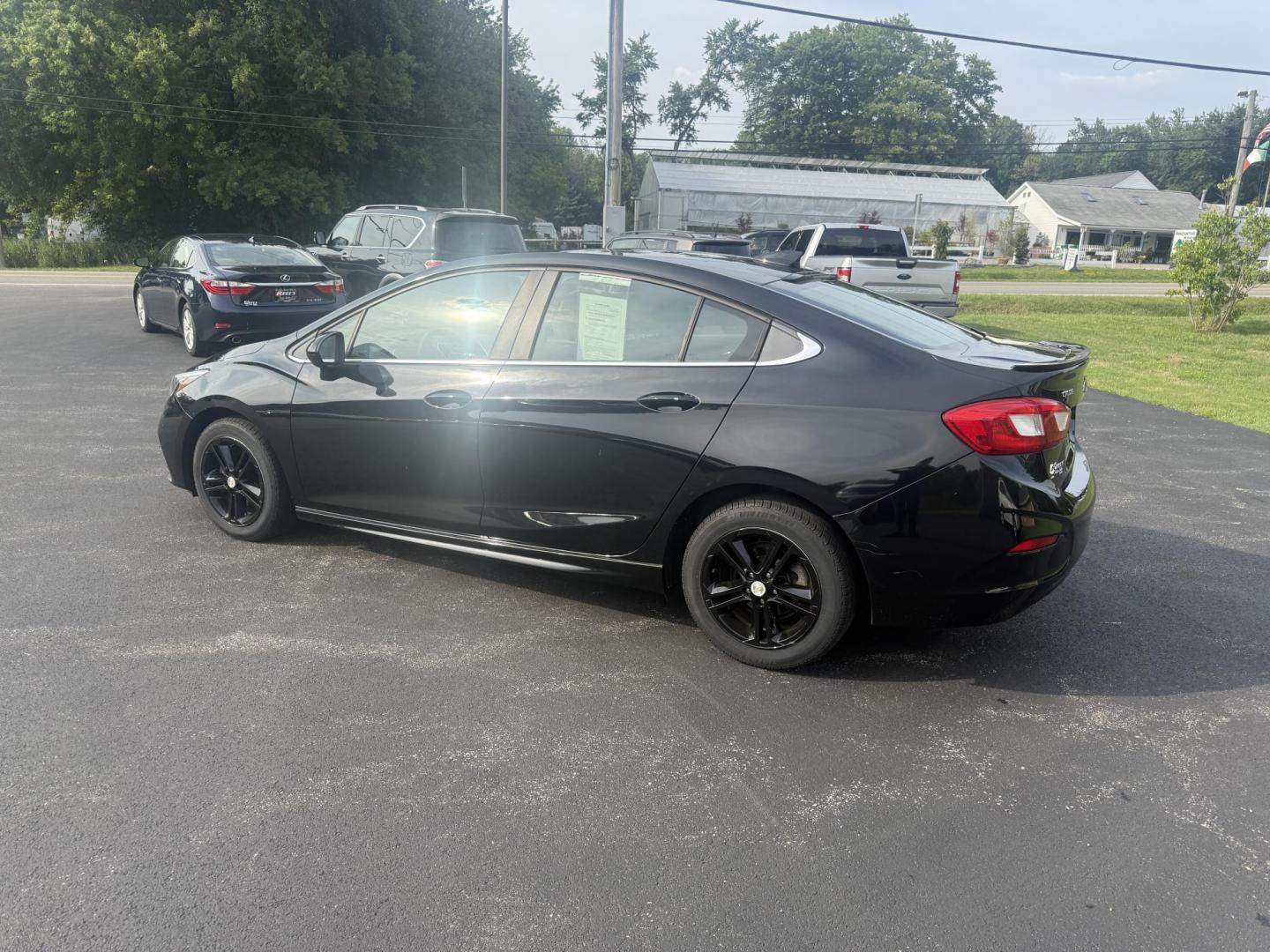 2016 Black /Black Chevrolet Cruze LT Auto (1G1BE5SM1G7) with an 1.4L I4 DOHC 16V TURBO engine, 6A transmission, located at 11115 Chardon Rd. , Chardon, OH, 44024, (440) 214-9705, 41.580246, -81.241943 - This 2016 Chevrolet Cruze LT RS features a 1.4L turbocharged EcoTec I4 engine with a 6-speed automatic transmission, achieving up to 40 MPG on the highway. This well-equipped sedan includes a power driver’s seat, push button start, heated front seats, remote start, the sporty RS package, a 7.0-inc - Photo#10