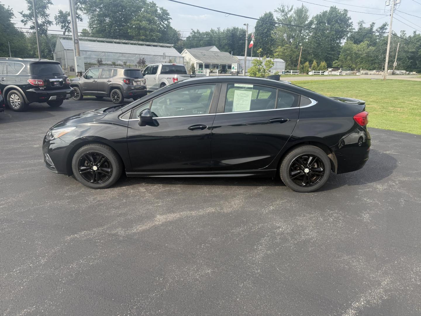2016 Black /Black Chevrolet Cruze LT Auto (1G1BE5SM1G7) with an 1.4L I4 DOHC 16V TURBO engine, 6A transmission, located at 11115 Chardon Rd. , Chardon, OH, 44024, (440) 214-9705, 41.580246, -81.241943 - This 2016 Chevrolet Cruze LT RS features a 1.4L turbocharged EcoTec I4 engine with a 6-speed automatic transmission, achieving up to 40 MPG on the highway. This well-equipped sedan includes a power driver’s seat, push button start, heated front seats, remote start, the sporty RS package, a 7.0-inc - Photo#12