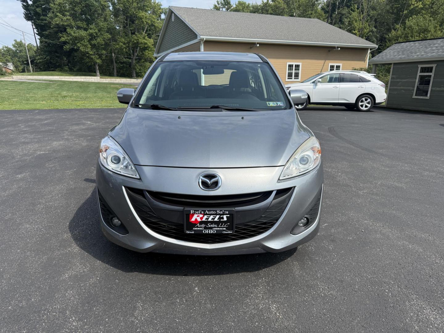 2015 Silver /Black Mazda MAZDA5 Grand Touring (JM1CW2DL0F0) with an 2.5L I4 DOHC 16V engine, 5-Speed Automatic transmission, located at 11115 Chardon Rd. , Chardon, OH, 44024, (440) 214-9705, 41.580246, -81.241943 - This 2015 Mazda Mazda 5 with a 2.5L I4 engine and 5-speed automatic transmission offers a versatile and comfortable minivan, achieving approximately 29 MPG highway. It features a leather interior, second-row captain’s seats, heated front seats, automatic climate control, a power moonroof, dusk-sen - Photo#1