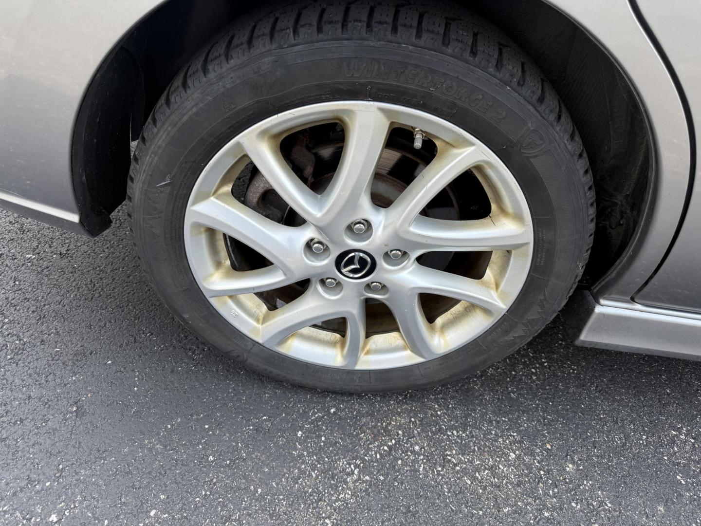 2015 Silver /Black Mazda MAZDA5 Grand Touring (JM1CW2DL0F0) with an 2.5L I4 DOHC 16V engine, 5-Speed Automatic transmission, located at 11115 Chardon Rd. , Chardon, OH, 44024, (440) 214-9705, 41.580246, -81.241943 - This 2015 Mazda Mazda 5 with a 2.5L I4 engine and 5-speed automatic transmission offers a versatile and comfortable minivan, achieving approximately 29 MPG highway. It features a leather interior, second-row captain’s seats, heated front seats, automatic climate control, a power moonroof, dusk-sen - Photo#6