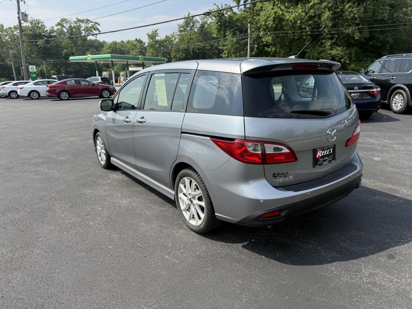 2015 Silver /Black Mazda MAZDA5 Grand Touring (JM1CW2DL0F0) with an 2.5L I4 DOHC 16V engine, 5-Speed Automatic transmission, located at 11115 Chardon Rd. , Chardon, OH, 44024, (440) 214-9705, 41.580246, -81.241943 - This 2015 Mazda Mazda 5 with a 2.5L I4 engine and 5-speed automatic transmission offers a versatile and comfortable minivan, achieving approximately 29 MPG highway. It features a leather interior, second-row captain’s seats, heated front seats, automatic climate control, a power moonroof, dusk-sen - Photo#9