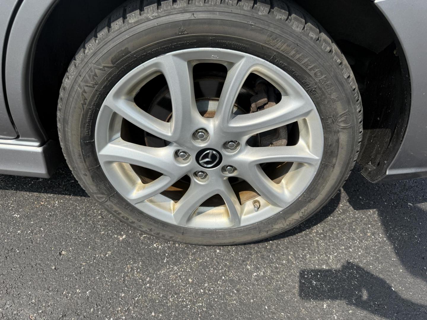 2015 Silver /Black Mazda MAZDA5 Grand Touring (JM1CW2DL0F0) with an 2.5L I4 DOHC 16V engine, 5-Speed Automatic transmission, located at 11115 Chardon Rd. , Chardon, OH, 44024, (440) 214-9705, 41.580246, -81.241943 - This 2015 Mazda Mazda 5 with a 2.5L I4 engine and 5-speed automatic transmission offers a versatile and comfortable minivan, achieving approximately 29 MPG highway. It features a leather interior, second-row captain’s seats, heated front seats, automatic climate control, a power moonroof, dusk-sen - Photo#11