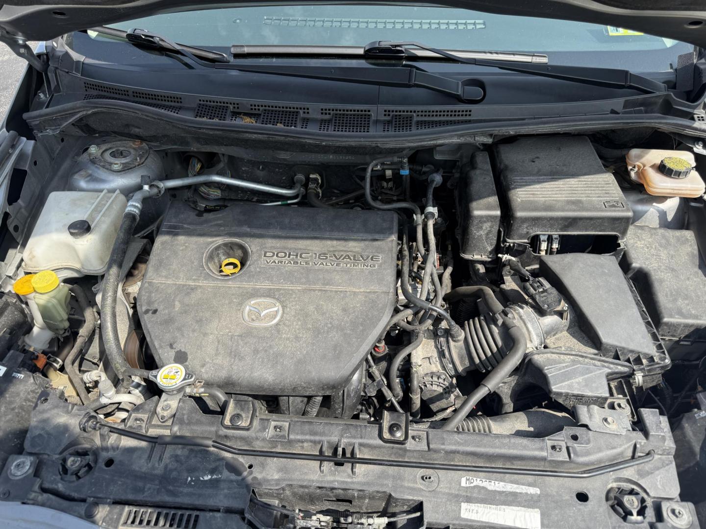 2015 Silver /Black Mazda MAZDA5 Grand Touring (JM1CW2DL0F0) with an 2.5L I4 DOHC 16V engine, 5-Speed Automatic transmission, located at 11115 Chardon Rd. , Chardon, OH, 44024, (440) 214-9705, 41.580246, -81.241943 - This 2015 Mazda Mazda 5 with a 2.5L I4 engine and 5-speed automatic transmission offers a versatile and comfortable minivan, achieving approximately 29 MPG highway. It features a leather interior, second-row captain’s seats, heated front seats, automatic climate control, a power moonroof, dusk-sen - Photo#14