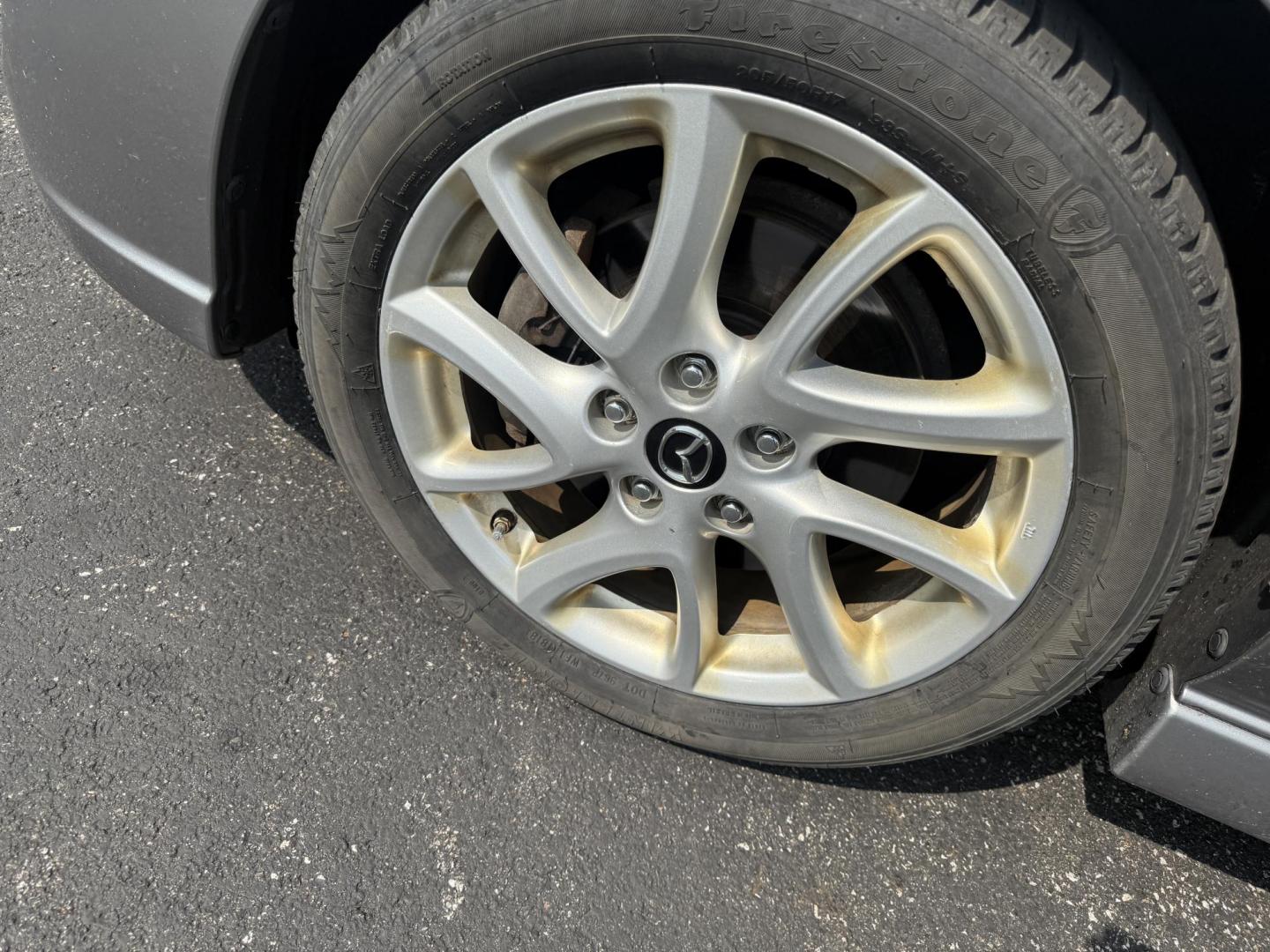 2015 Silver /Black Mazda MAZDA5 Grand Touring (JM1CW2DL0F0) with an 2.5L I4 DOHC 16V engine, 5-Speed Automatic transmission, located at 11115 Chardon Rd. , Chardon, OH, 44024, (440) 214-9705, 41.580246, -81.241943 - This 2015 Mazda Mazda 5 with a 2.5L I4 engine and 5-speed automatic transmission offers a versatile and comfortable minivan, achieving approximately 29 MPG highway. It features a leather interior, second-row captain’s seats, heated front seats, automatic climate control, a power moonroof, dusk-sen - Photo#13