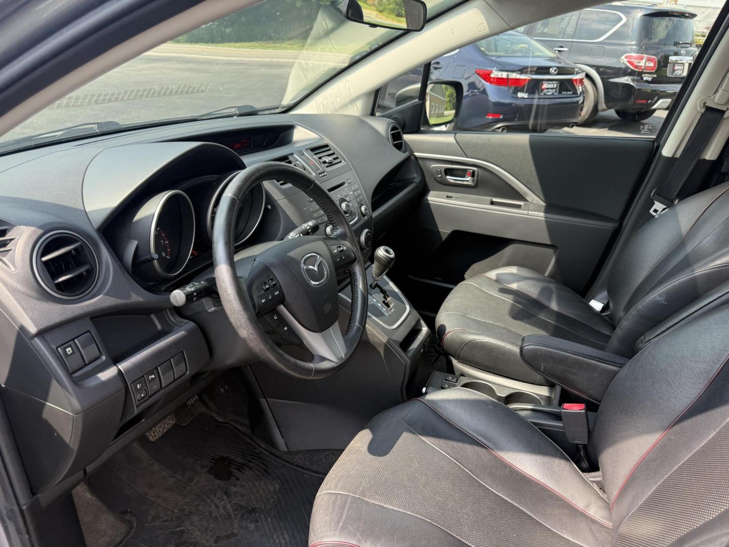 2015 Silver /Black Mazda MAZDA5 Grand Touring (JM1CW2DL0F0) with an 2.5L I4 DOHC 16V engine, 5-Speed Automatic transmission, located at 11115 Chardon Rd. , Chardon, OH, 44024, (440) 214-9705, 41.580246, -81.241943 - This 2015 Mazda Mazda 5 with a 2.5L I4 engine and 5-speed automatic transmission offers a versatile and comfortable minivan, achieving approximately 29 MPG highway. It features a leather interior, second-row captain’s seats, heated front seats, automatic climate control, a power moonroof, dusk-sen - Photo#15
