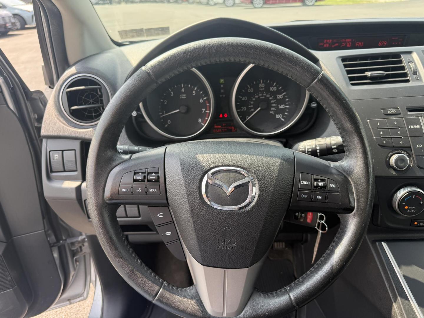 2015 Silver /Black Mazda MAZDA5 Grand Touring (JM1CW2DL0F0) with an 2.5L I4 DOHC 16V engine, 5-Speed Automatic transmission, located at 11115 Chardon Rd. , Chardon, OH, 44024, (440) 214-9705, 41.580246, -81.241943 - This 2015 Mazda Mazda 5 with a 2.5L I4 engine and 5-speed automatic transmission offers a versatile and comfortable minivan, achieving approximately 29 MPG highway. It features a leather interior, second-row captain’s seats, heated front seats, automatic climate control, a power moonroof, dusk-sen - Photo#22