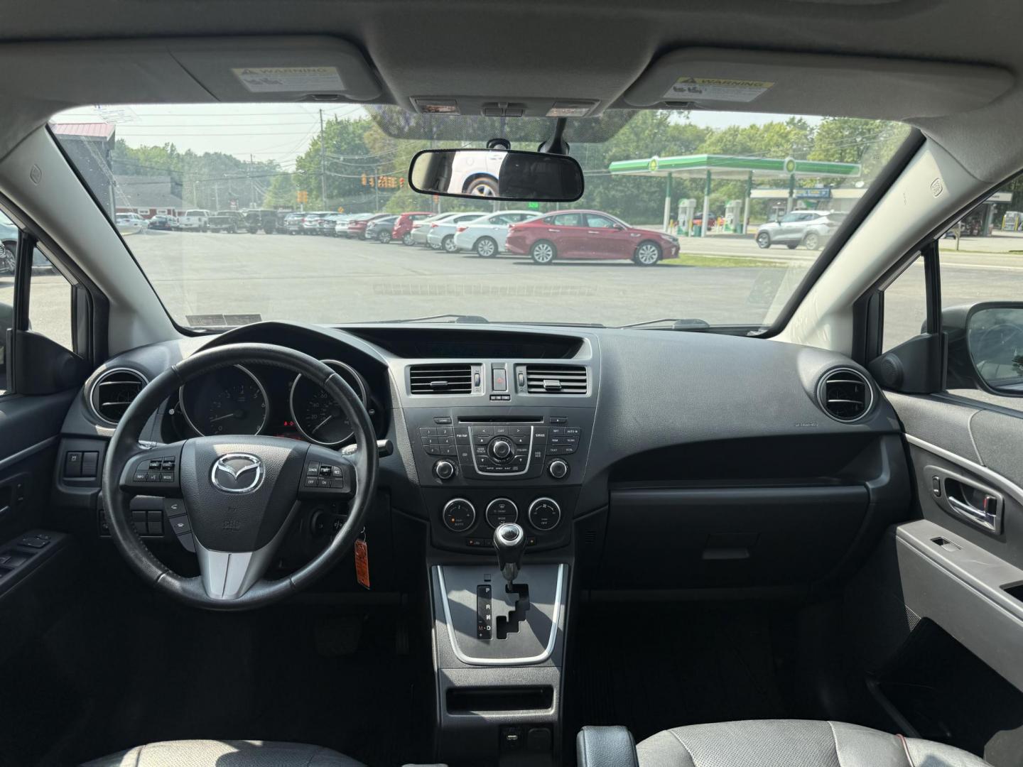 2015 Silver /Black Mazda MAZDA5 Grand Touring (JM1CW2DL0F0) with an 2.5L I4 DOHC 16V engine, 5-Speed Automatic transmission, located at 11115 Chardon Rd. , Chardon, OH, 44024, (440) 214-9705, 41.580246, -81.241943 - This 2015 Mazda Mazda 5 with a 2.5L I4 engine and 5-speed automatic transmission offers a versatile and comfortable minivan, achieving approximately 29 MPG highway. It features a leather interior, second-row captain’s seats, heated front seats, automatic climate control, a power moonroof, dusk-sen - Photo#33