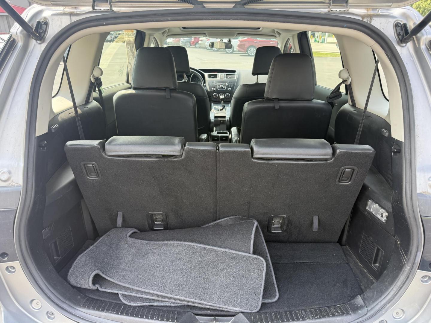2015 Silver /Black Mazda MAZDA5 Grand Touring (JM1CW2DL0F0) with an 2.5L I4 DOHC 16V engine, 5-Speed Automatic transmission, located at 11115 Chardon Rd. , Chardon, OH, 44024, (440) 214-9705, 41.580246, -81.241943 - This 2015 Mazda Mazda 5 with a 2.5L I4 engine and 5-speed automatic transmission offers a versatile and comfortable minivan, achieving approximately 29 MPG highway. It features a leather interior, second-row captain’s seats, heated front seats, automatic climate control, a power moonroof, dusk-sen - Photo#34